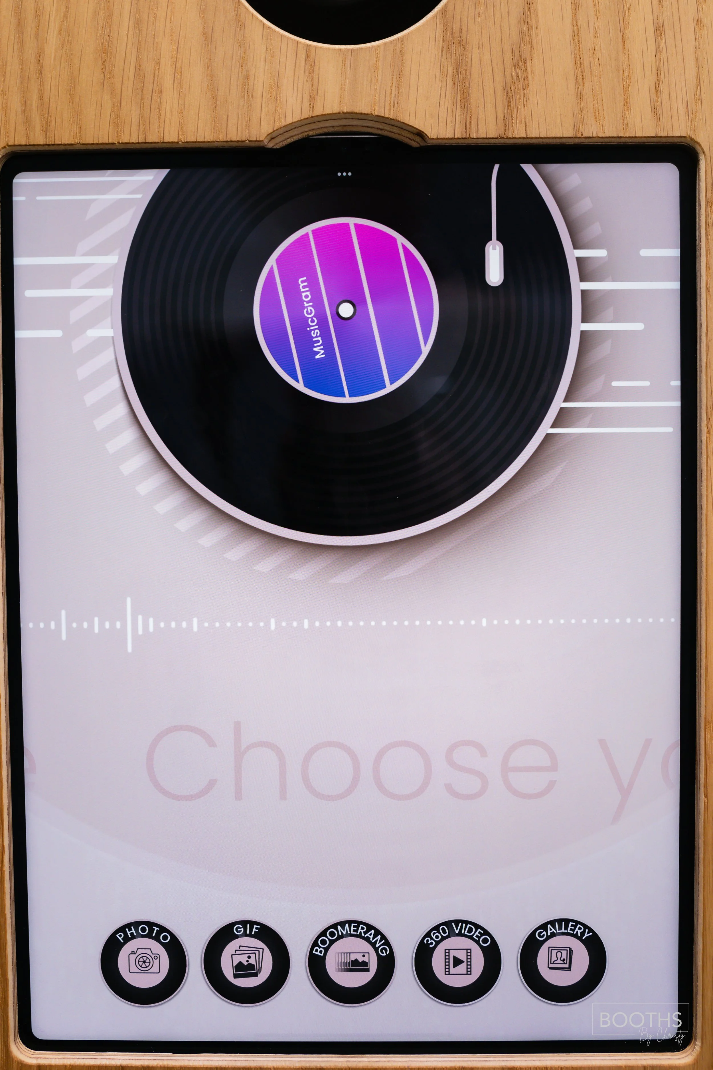 Mobile app interface with a graphic of a vinyl record and the words 'MusicGram' in the center, showing options for photo, GIF, Boomerang, 360 video, and gallery at the bottom.