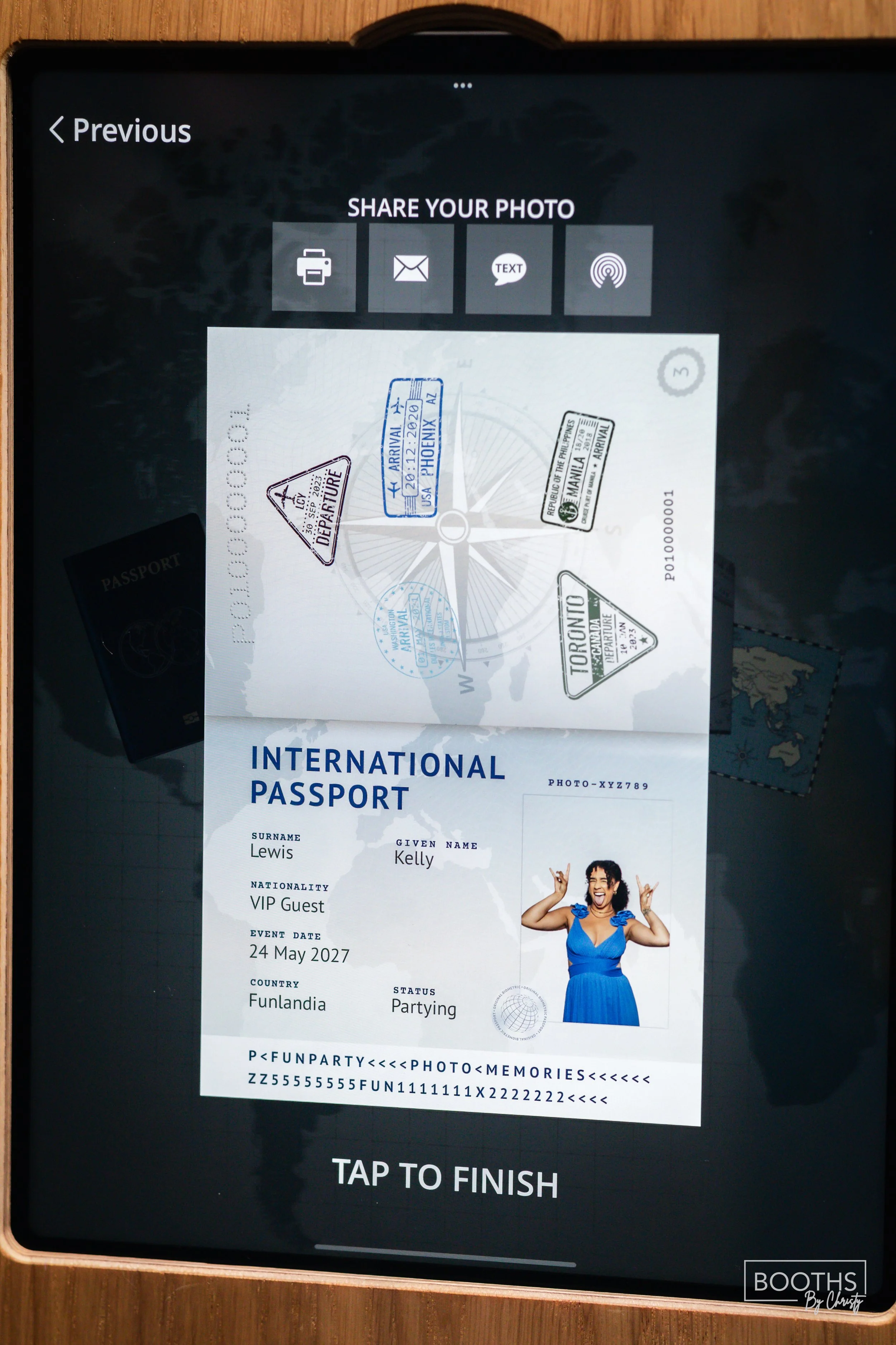 A digital screen displaying a virtual international passport with the name Kelly Lewis, VIP Guest, born on May 24, 2027, from Funlandia, currently partying. The passport includes a photo of a woman in a blue dress making a gesture with her hands and