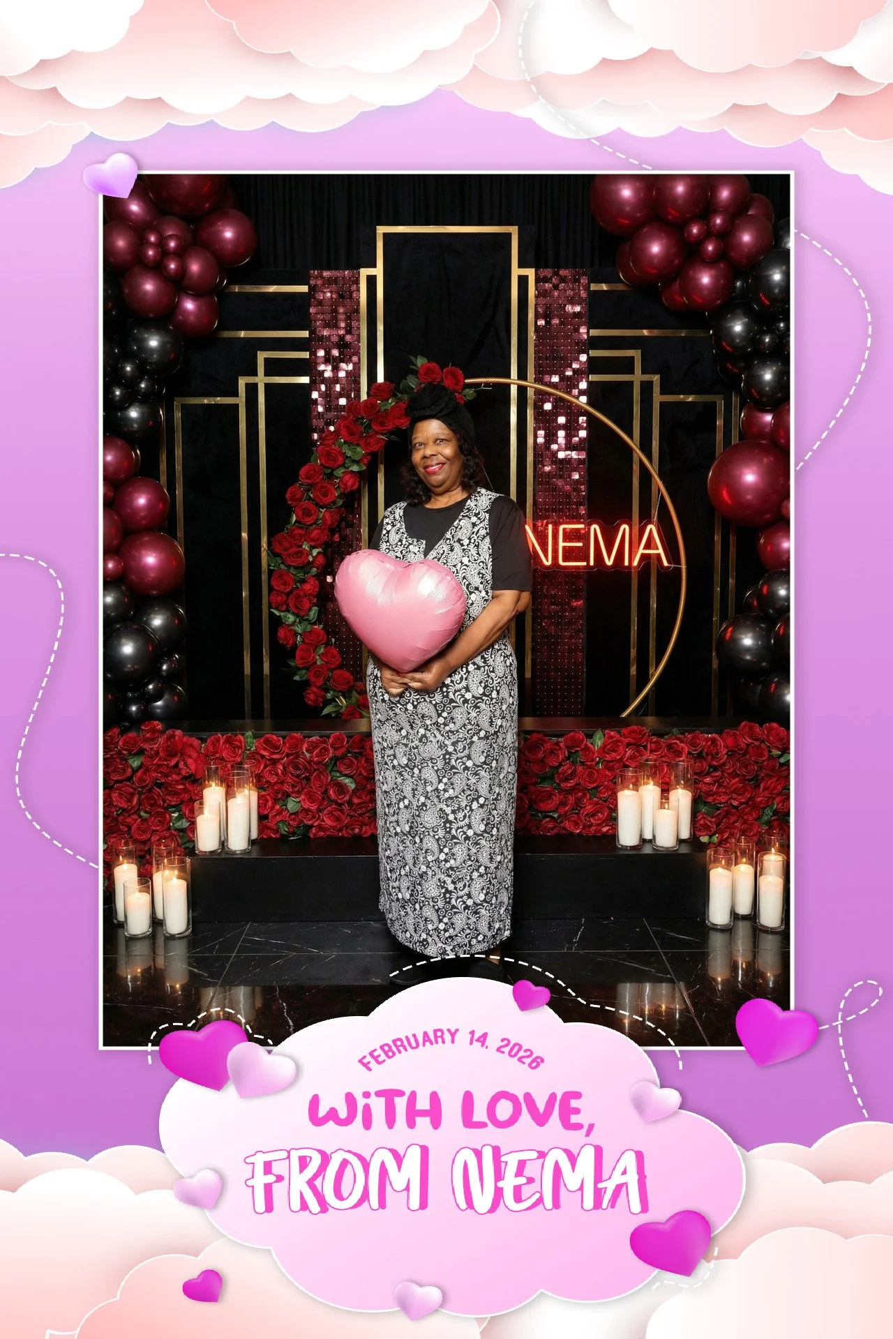 A woman holding a pink heart-shaped balloon, standing in front of a Valentine's Day-themed backdrop decorated with red roses, candles, and balloons, with the words 'With Love, From Nema' and the date February 14, 2026.
