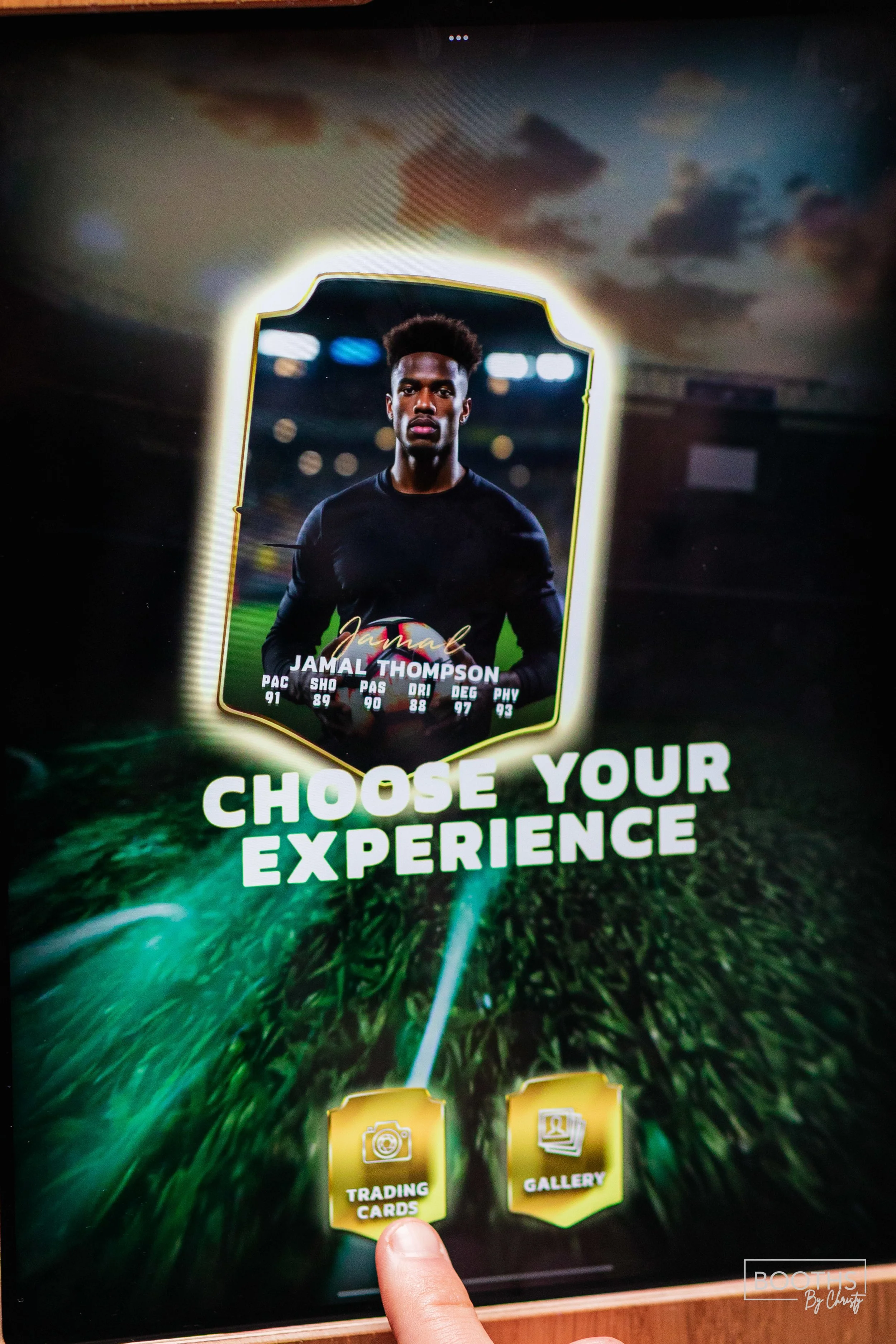 Digital sports card selection screen featuring Jamal Thompson with stats, with options for trading cards and gallery below.