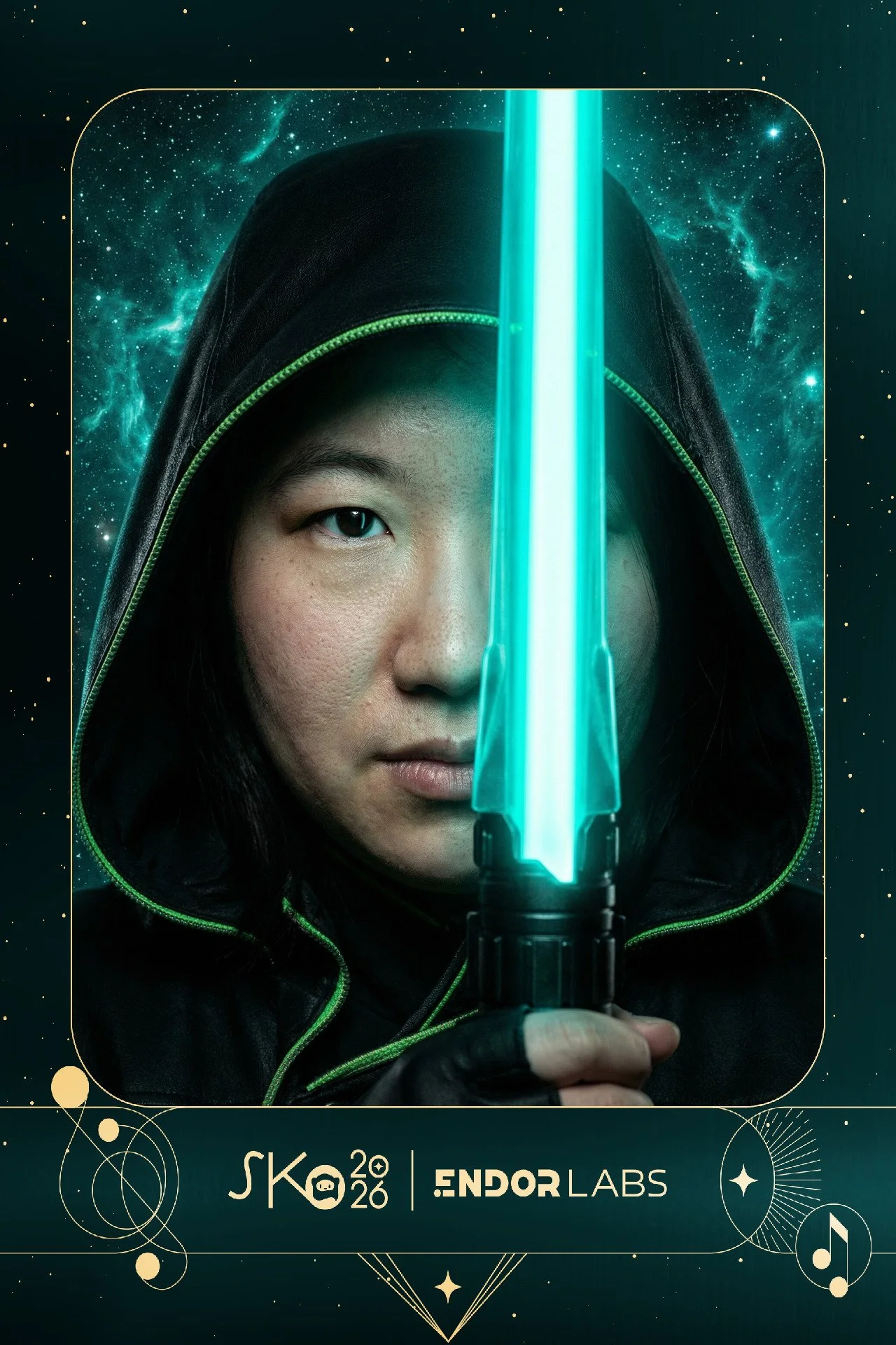 A woman with dark hair and a serious expression, wearing a black hooded cloak with green trim, holding a glowing blue lightsaber, with a starry galaxy background.