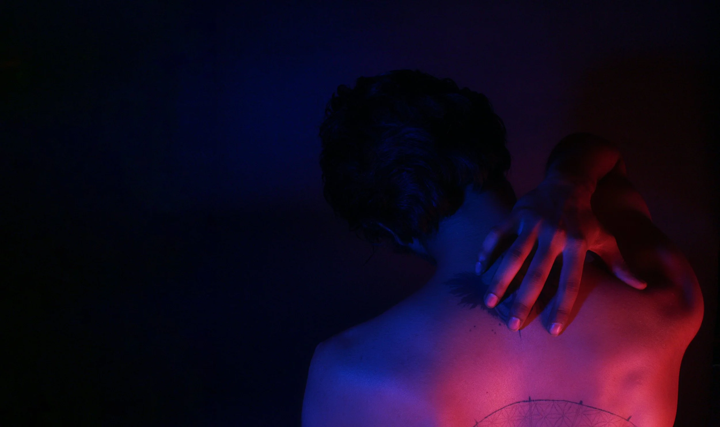 Man clutching his back in pain