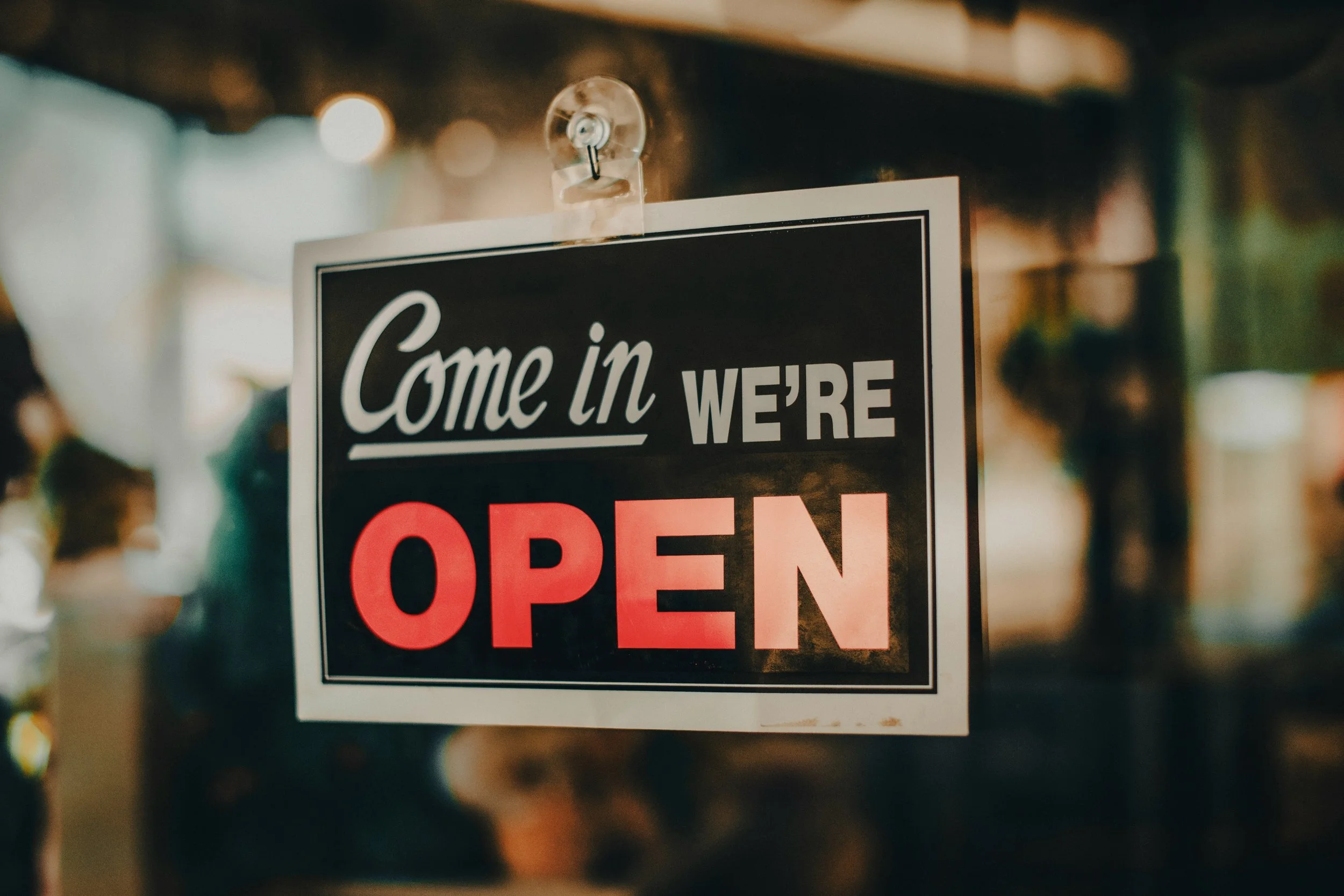 Small business come in we are open window sign