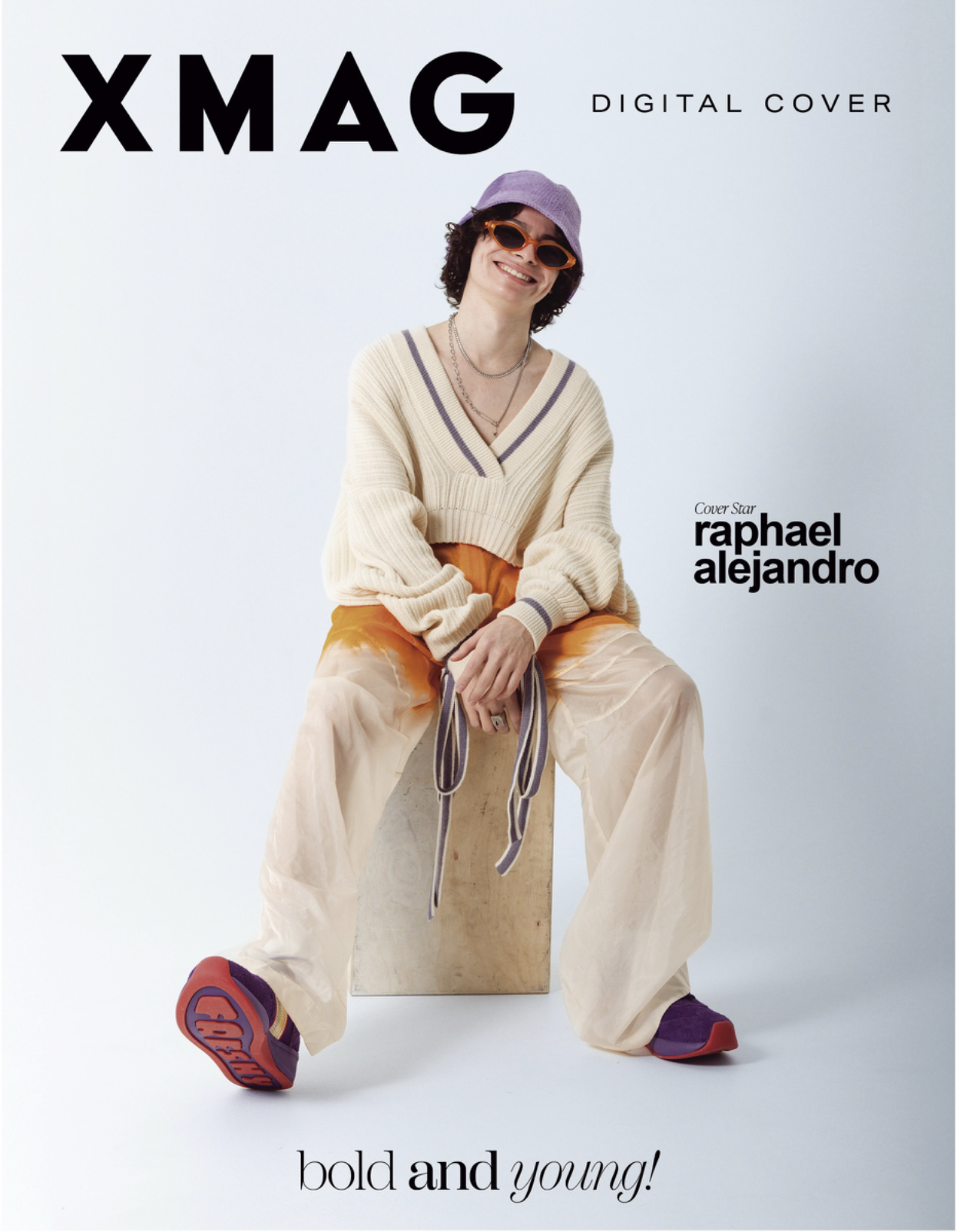 Cover of XMAG digital magazine featuring rapper Raphael Alejandro sitting on a wooden block, wearing a purple hat, orange sunglasses, a cream-colored sweater, orange trousers, and sneakers. The cover has the text 'XMAG', 'Digital Cover', and 'bold an