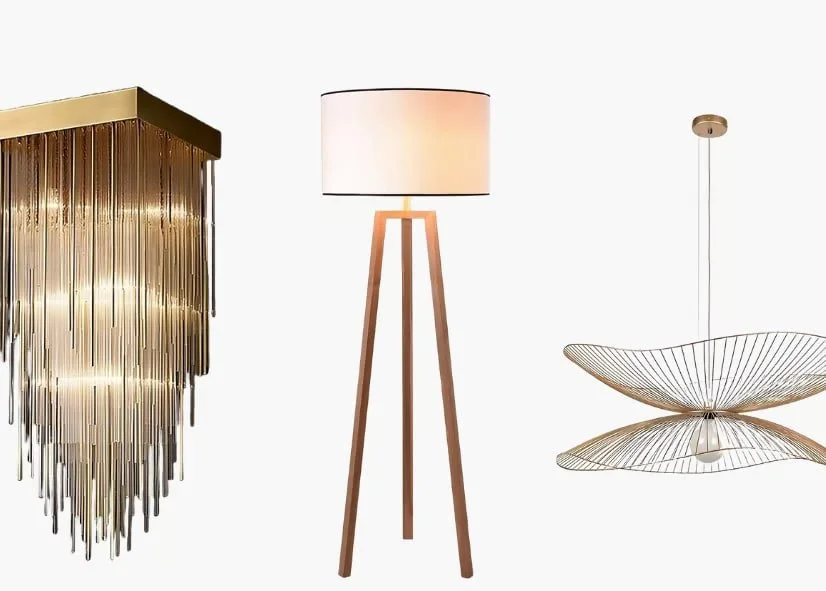 A gold and crystal chandelier on the left, a wooden floor lamp with a white shade in the center, and a modern wire hanging chair on the right.