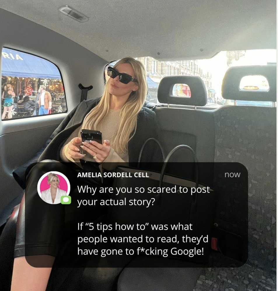 Image of a blonde woman wearing sunglasses and sitting in the back of a car, holding her phone. A message overlay from Amelia Sordell Cell reads, “Why are you so scared to post your actual story?”