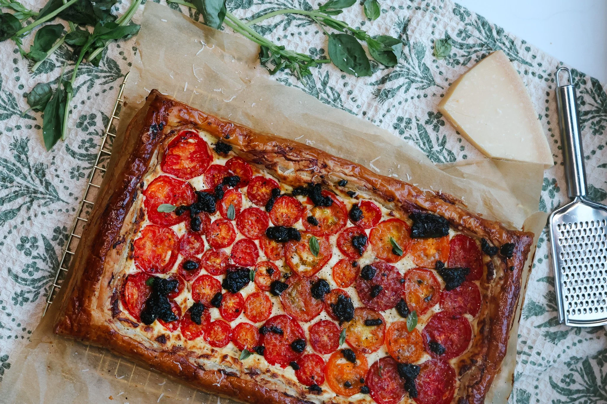 CHEESE &amp; TOMATO TART WITH A BLACK GARLIC BASIL DRIZZLE