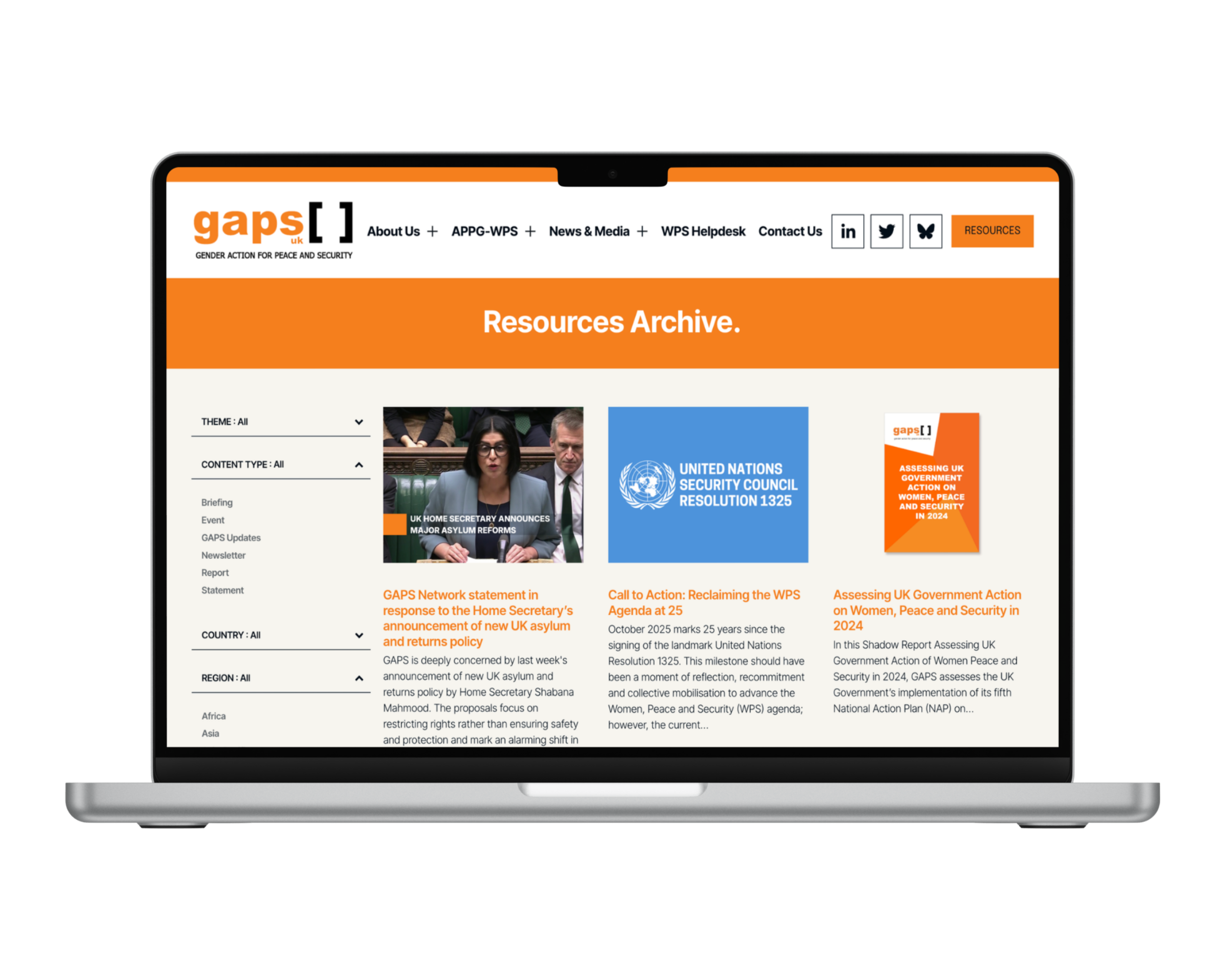 Laptop displaying the GAPS UK Resources Archive webpage with news articles, reports, and a blue United Nations Security Council resolution graphic.