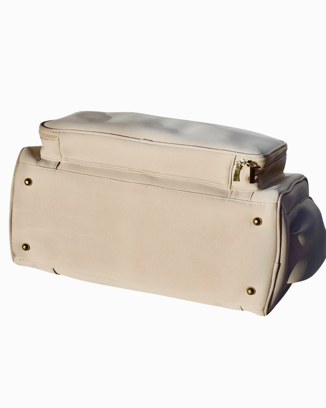 Base of the Adieu Core Duffle showing protective metal feet and structured design.