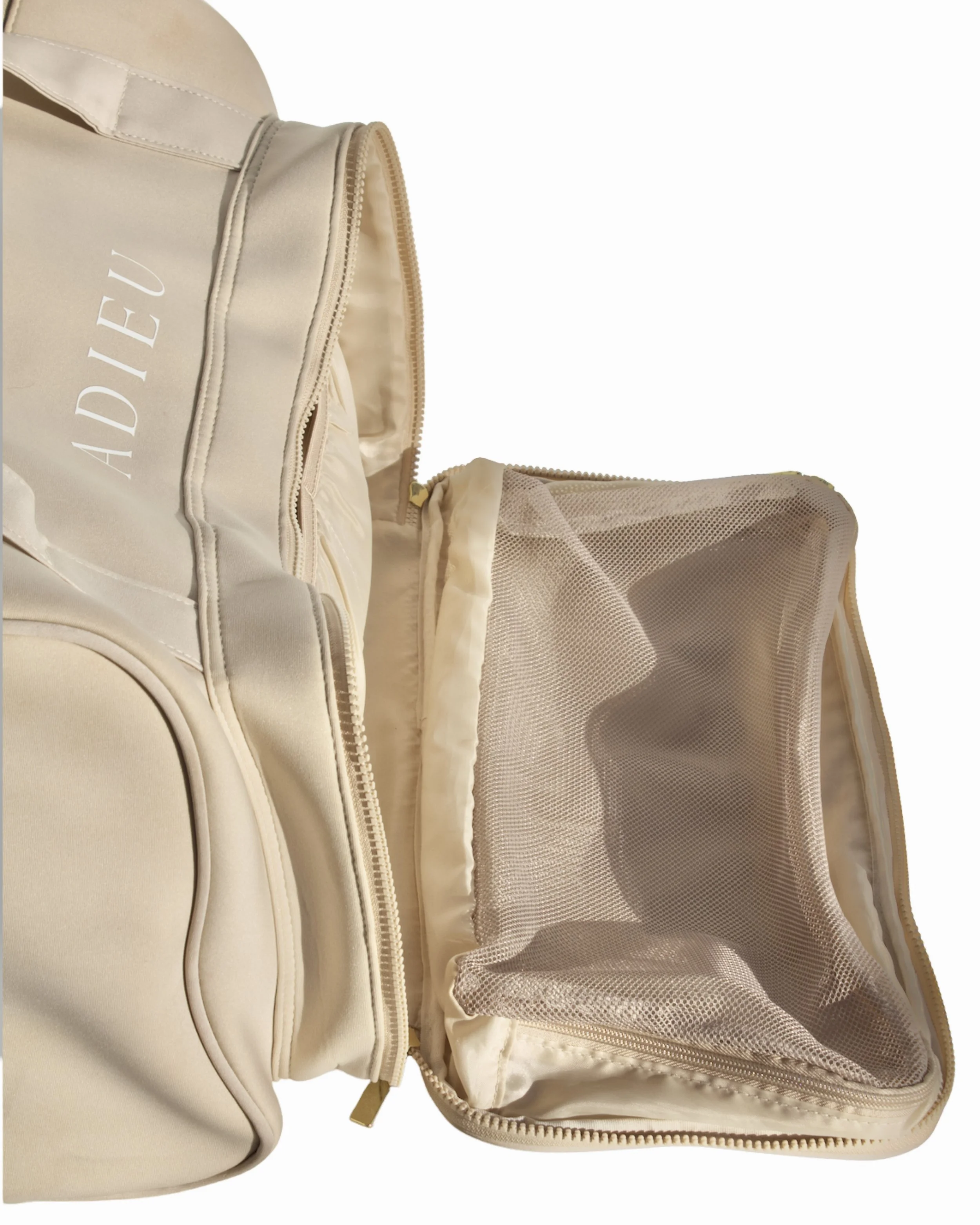 Side opening of the Adieu Core Duffle featuring a breathable spacious mesh compartment for shoes or clothing.
