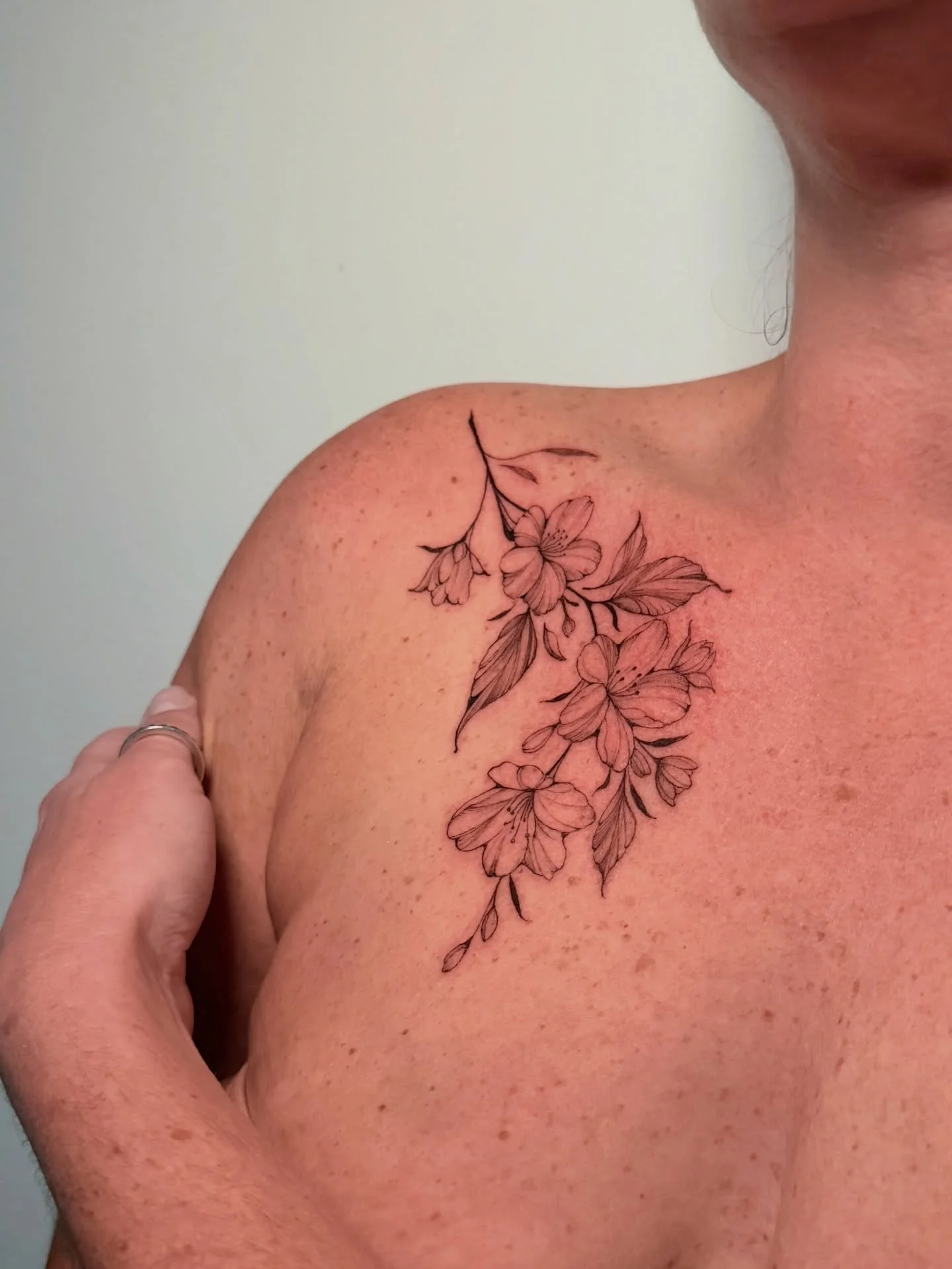 Delicate fine line floral tattoo in the most stunning placement! I&rsquo;m in love with this flow. This is the start to a larger and more elaborate chest tattoo that I&rsquo;m doing with my awesome client! Can&rsquo;t wait to show you all when it&rsq