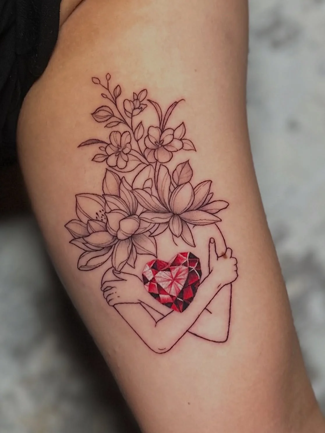 She&rsquo;s not looking for someone to hold her heart anymore. She&rsquo;s holding it herself. 🌸

Fine line &bull; Color detail &bull; Upper arm

Palm Beach County, FL ✦ Link in bio.

#westpalmbeach #southfloridatattooartist #gemstonetattoo #finelin