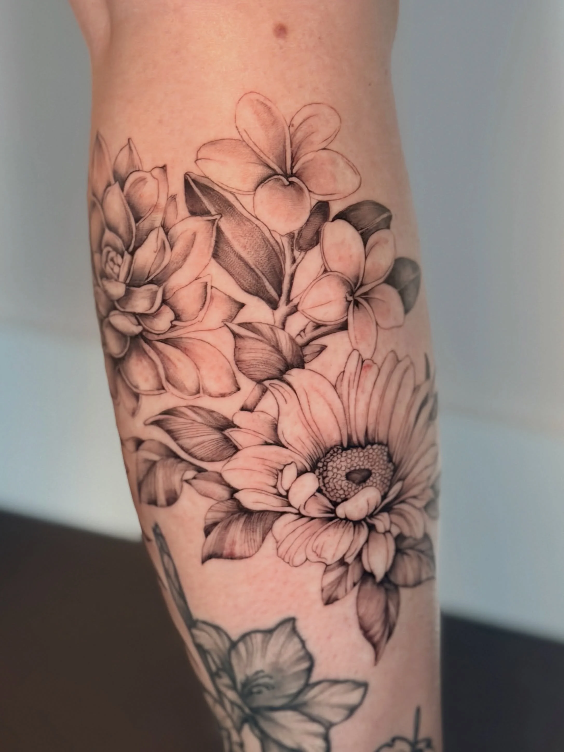 Not every canvas is blank. She came in with existing work and wanted to add to her story. Designing around a pre-existing tattoo requires a different eye; the new work has to feel complete on its own while still respecting what&rsquo;s already there.