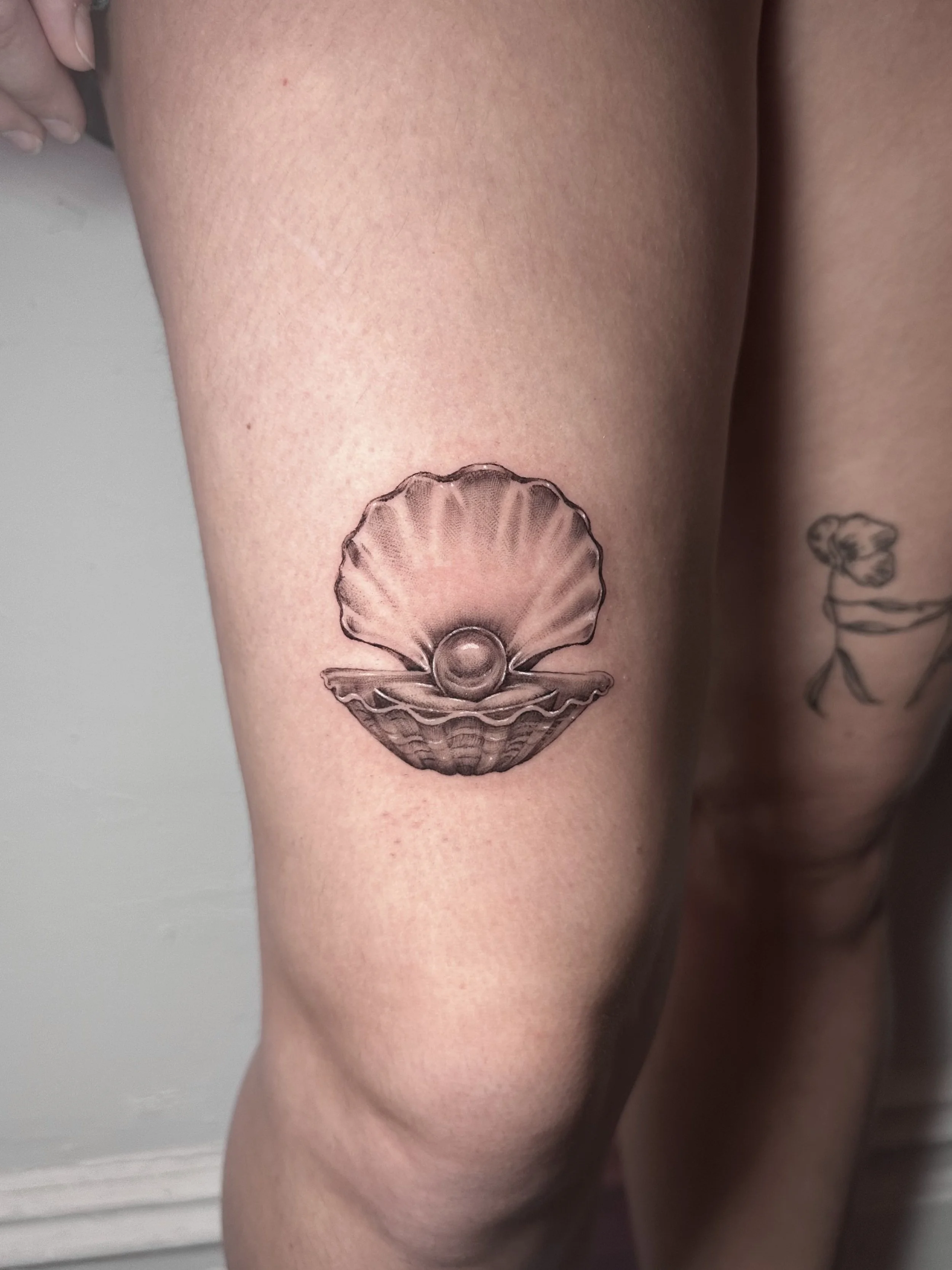 west-palm-beach-fine-line-shell-tattoo-florida.jpg