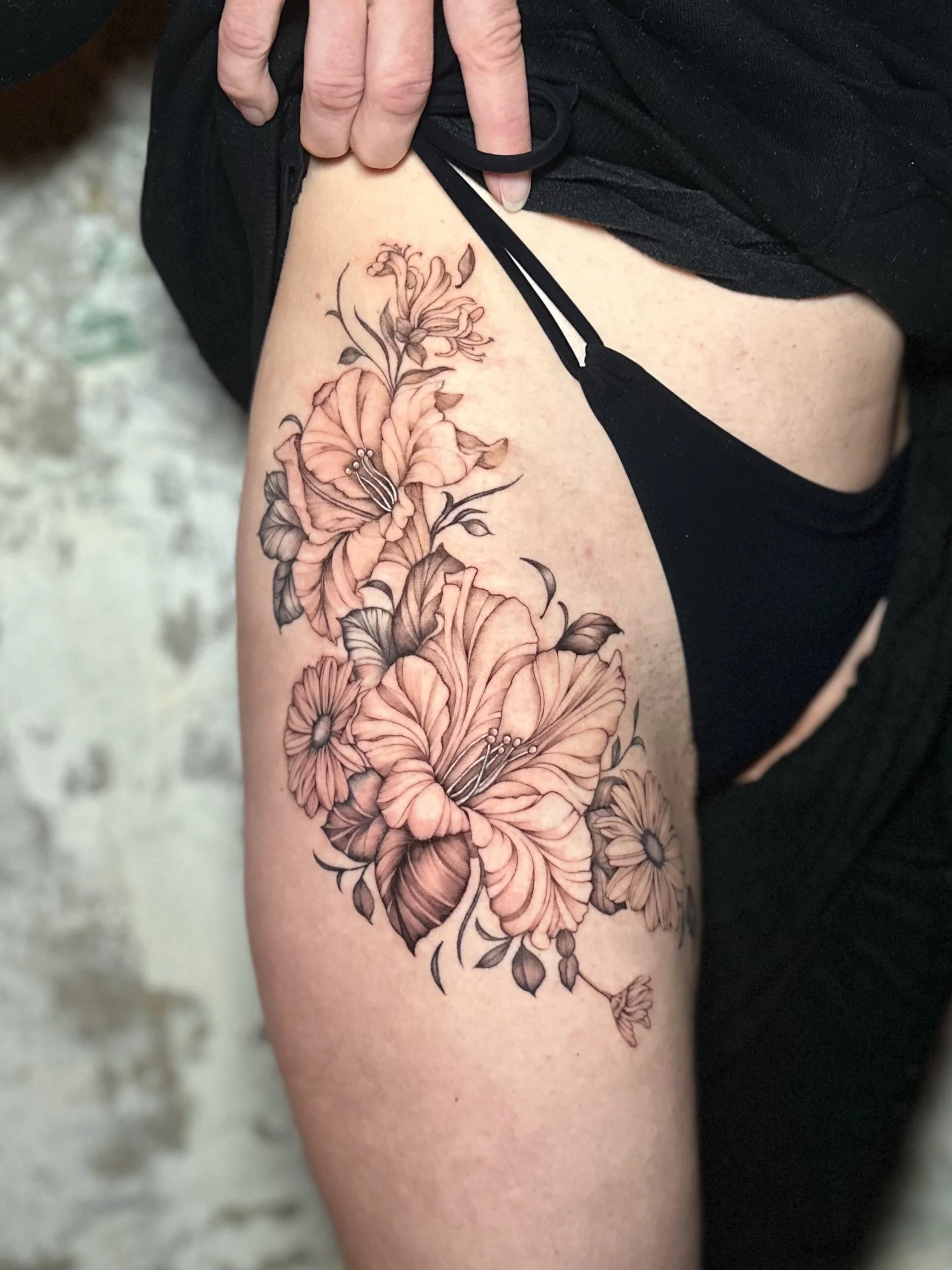west-palm-beach-fine-line-botanical-thigh-tattoo.jpg