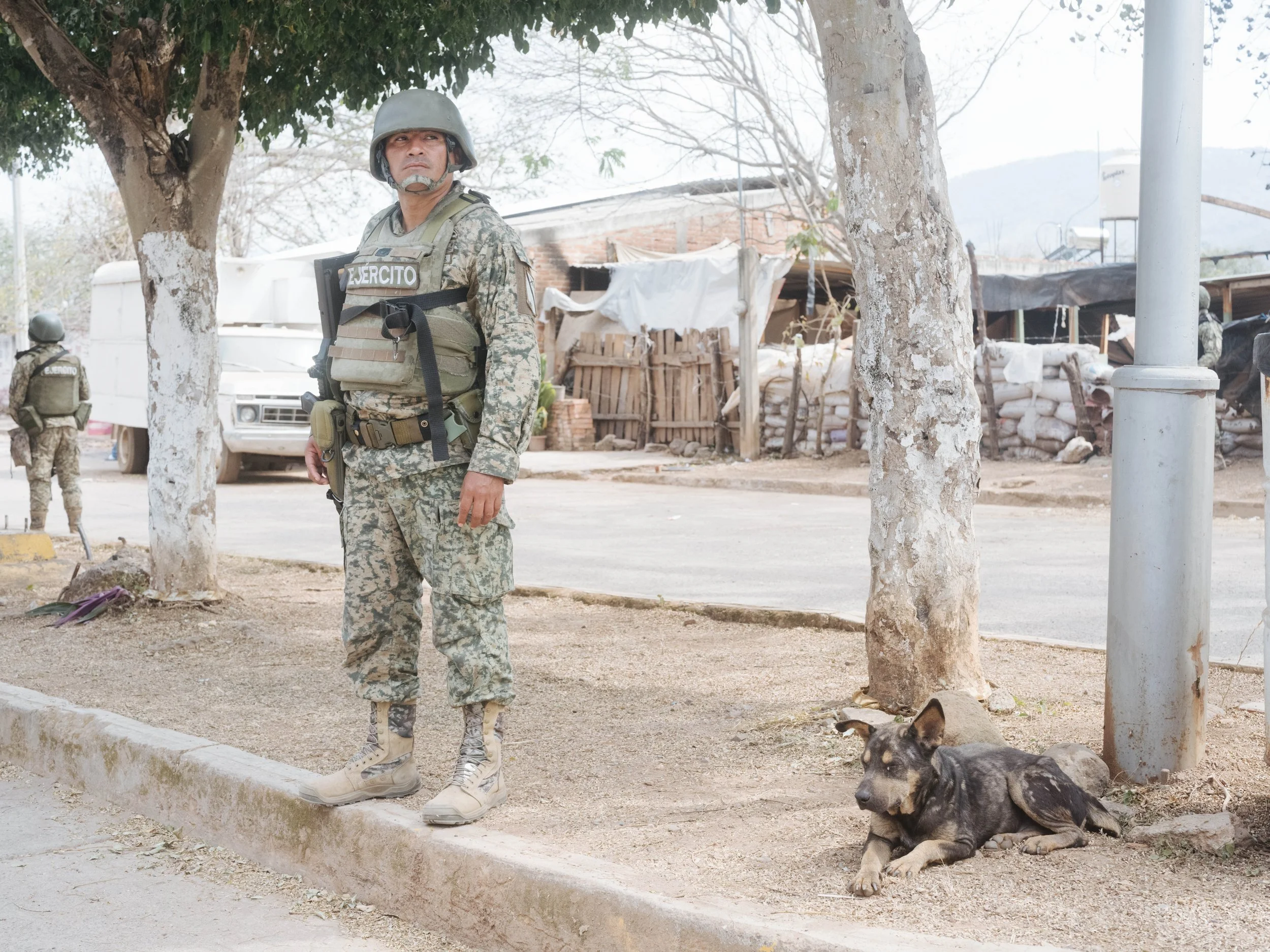 A Mexican Army soldier stands guard in Aguililla, Michoacán, where military presence remains in the region.