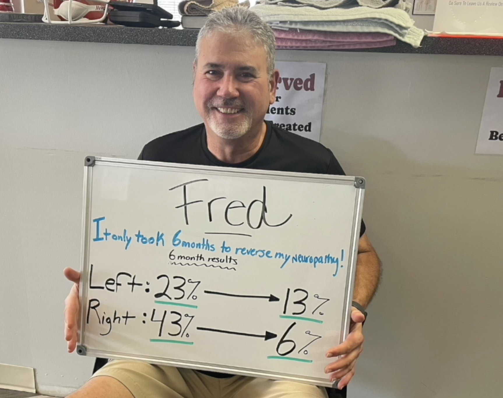 Man sitting and holding a whiteboard with text about neuropathy improvement percentages, showing 23% to 13% on the left and 43% to 6% on the right.