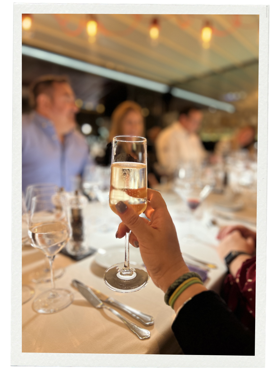 Kat Morga travel advisor in Dubrovik Croatia holding a glass of wine