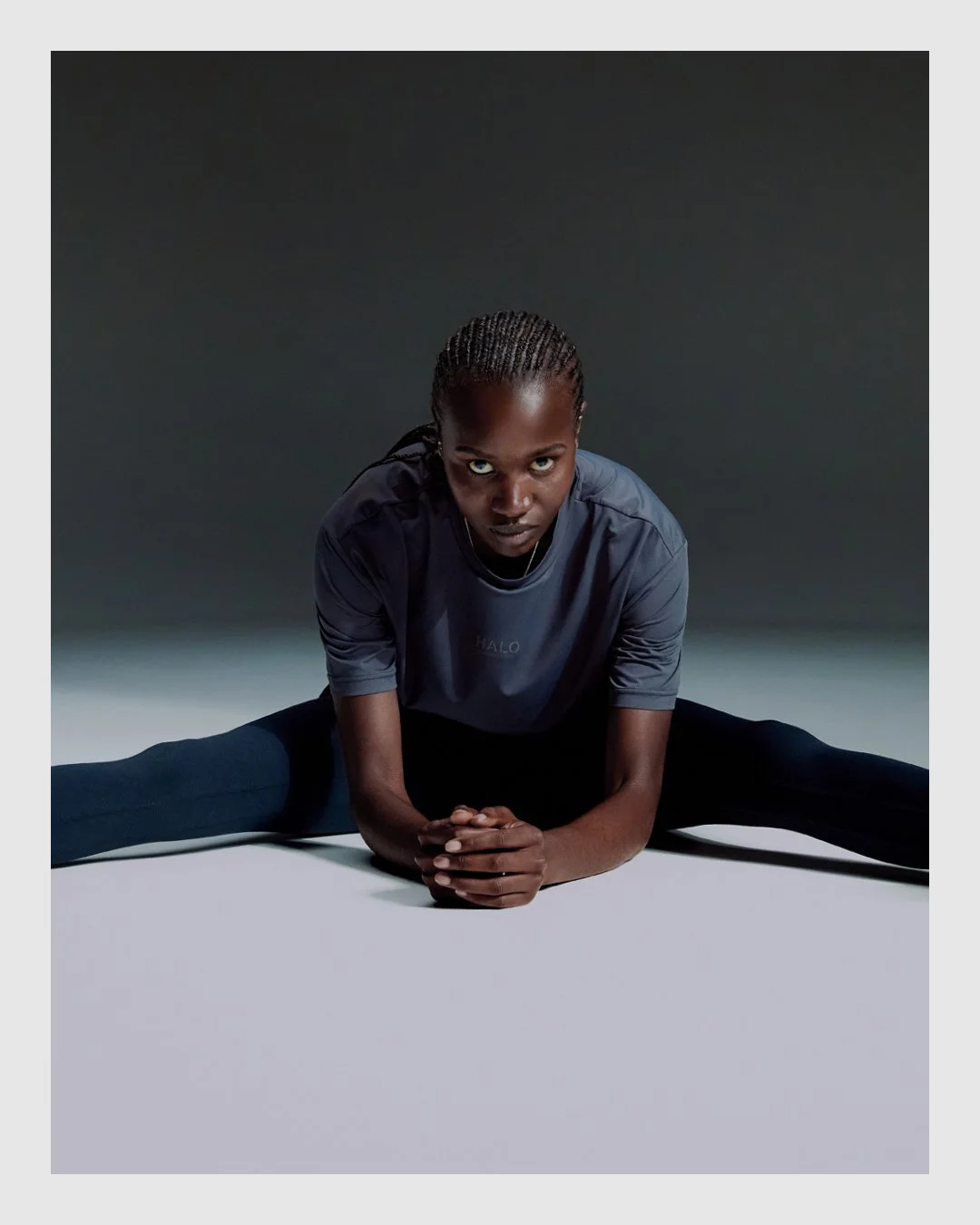 HALO campaign image of athlete in dark performance clothing with dramatic studio lighting