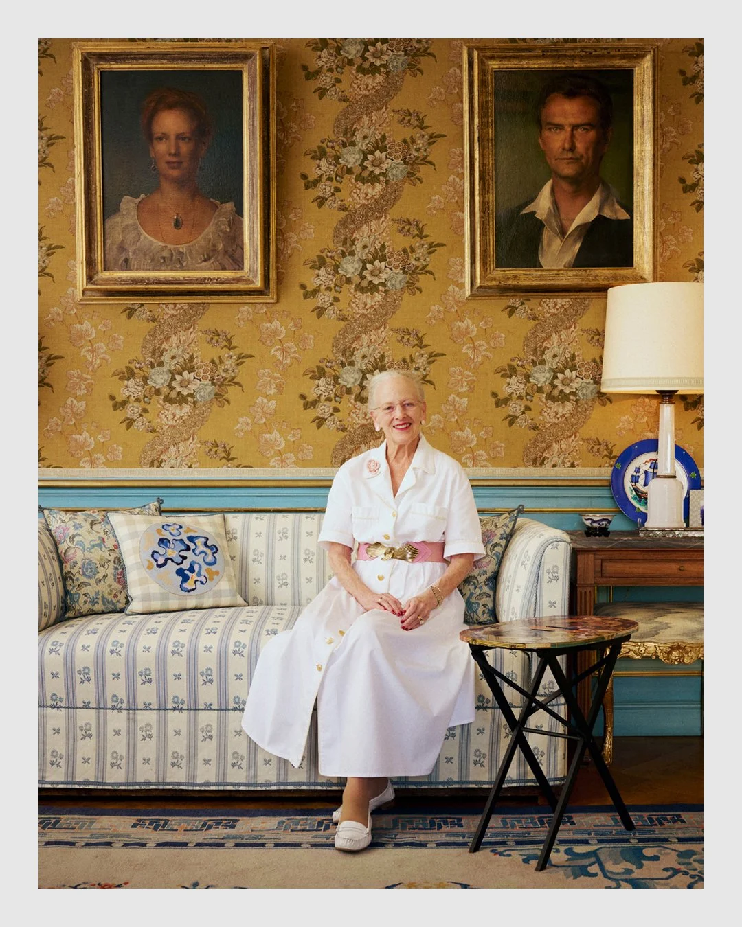 Queen Margrethe II seated in an ornate room at the royal residence