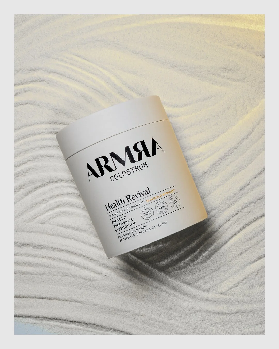ARMRA Health Revival product on a textured white powder surface
