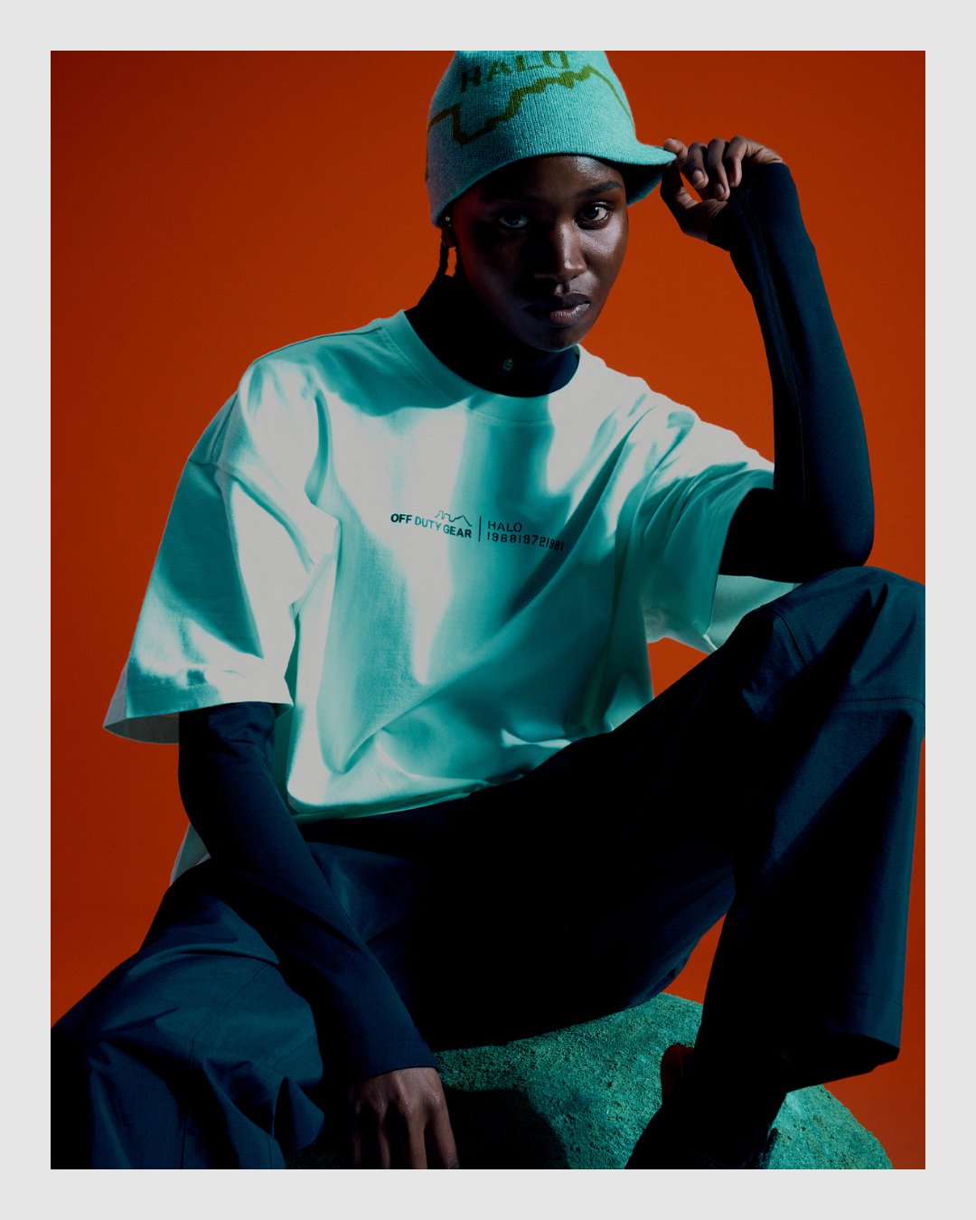 HALO campaign portrait with shirt and vivid orange background