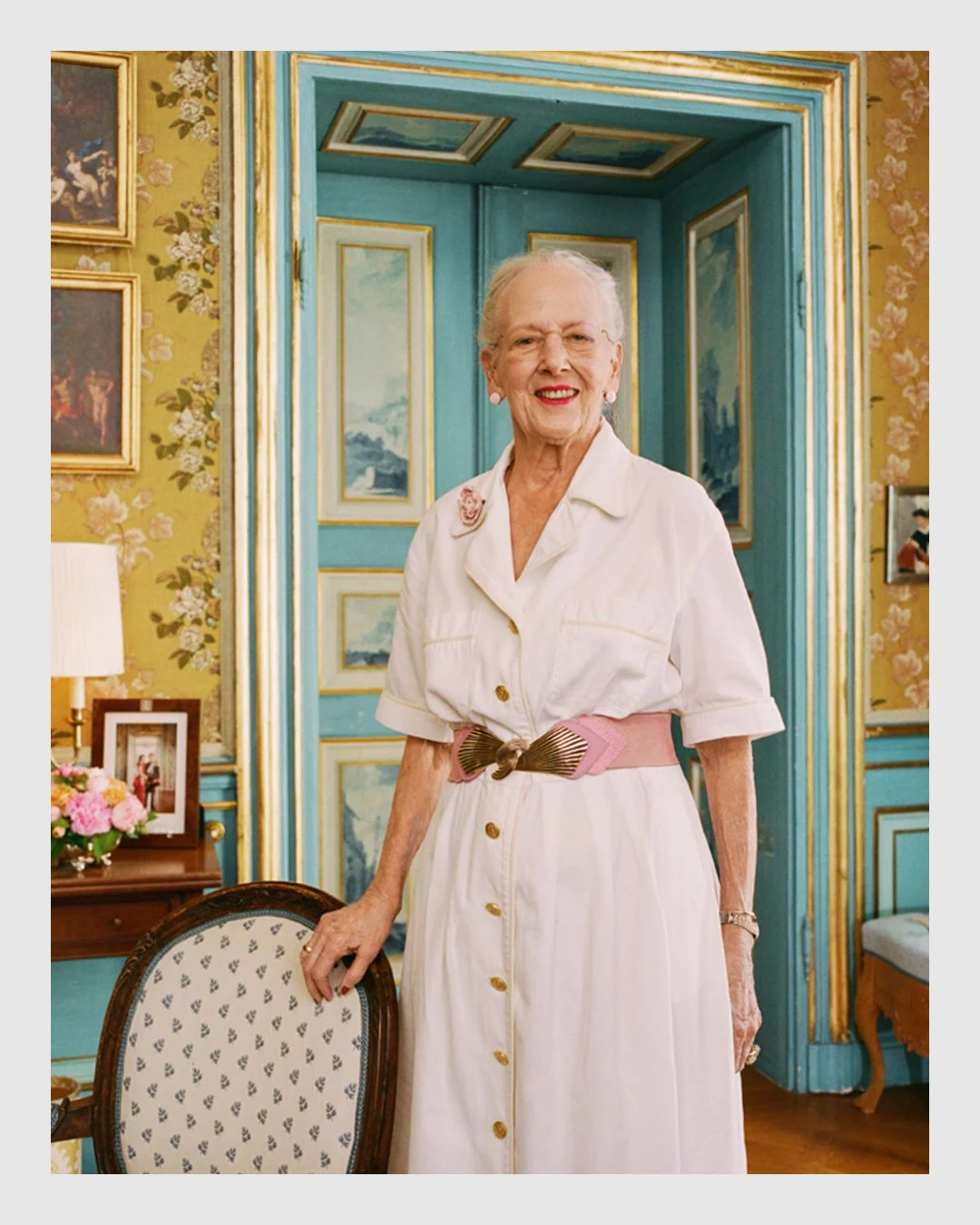 Portrait of Queen Margrethe II standing in an ornate palace interior