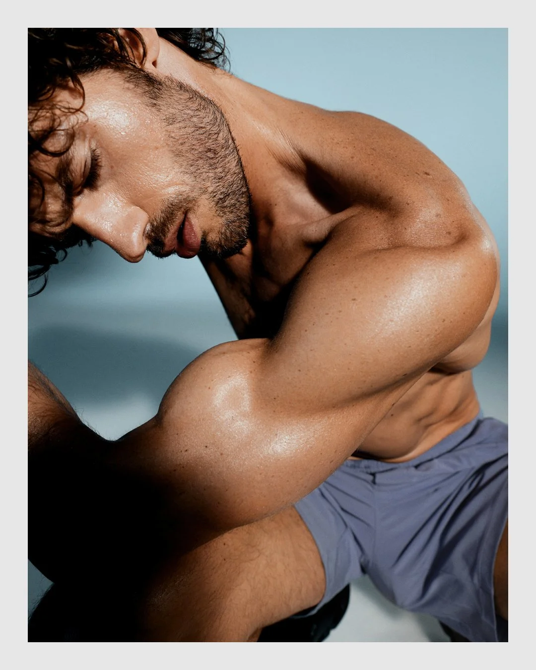 Male model posing with muscular arm in the ARMRA campaign