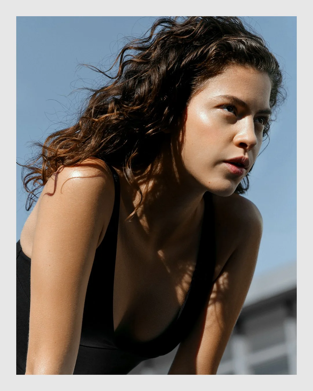 Portrait of woman in black top from the ARMRA campaign