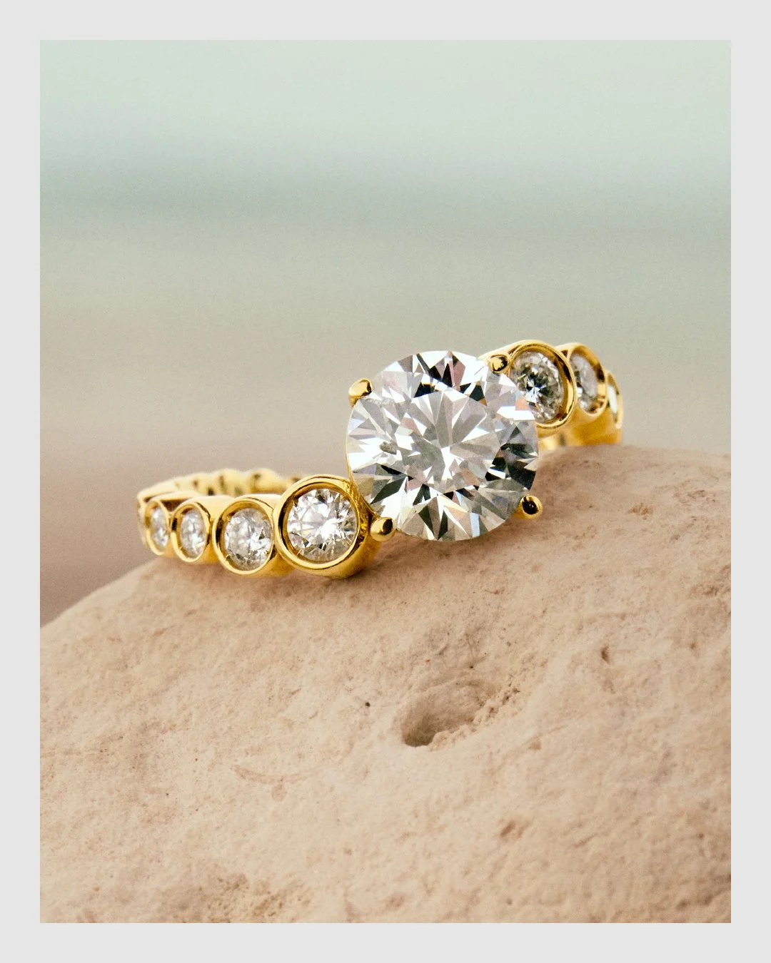 Cherituelle diamond and 18k gold ring photographed on a natural stone surface – fine jewelry campaign retouching by Le Lemon