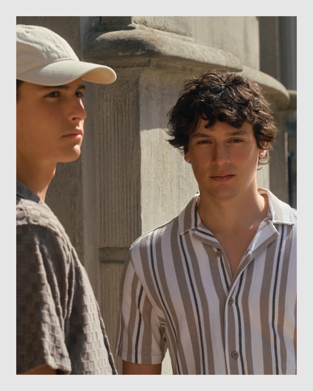 Two male models wearing relaxed striped and textured summer shirts by Brothers