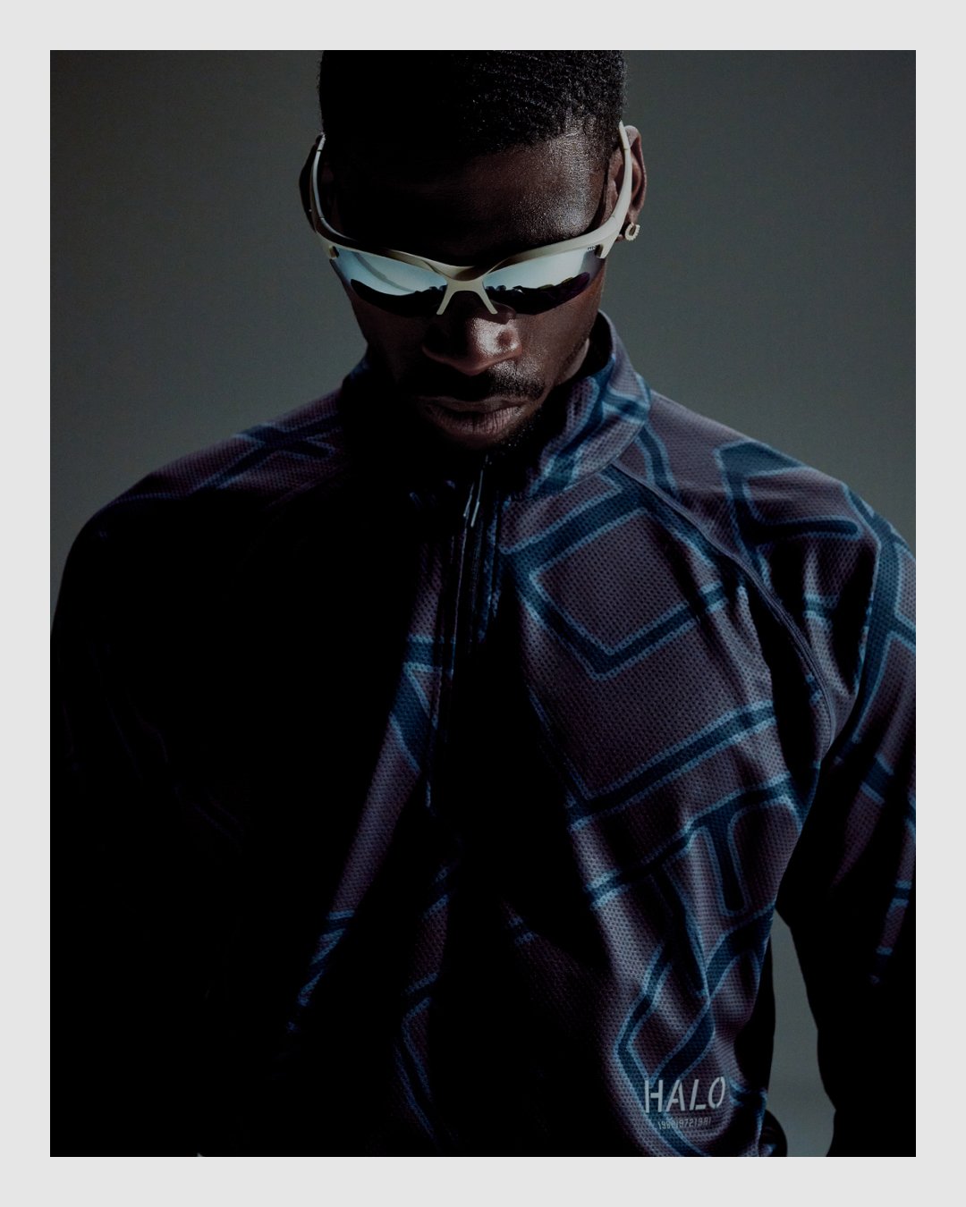 HALO menswear campaign portrait with performance eyewear and patterned technical top