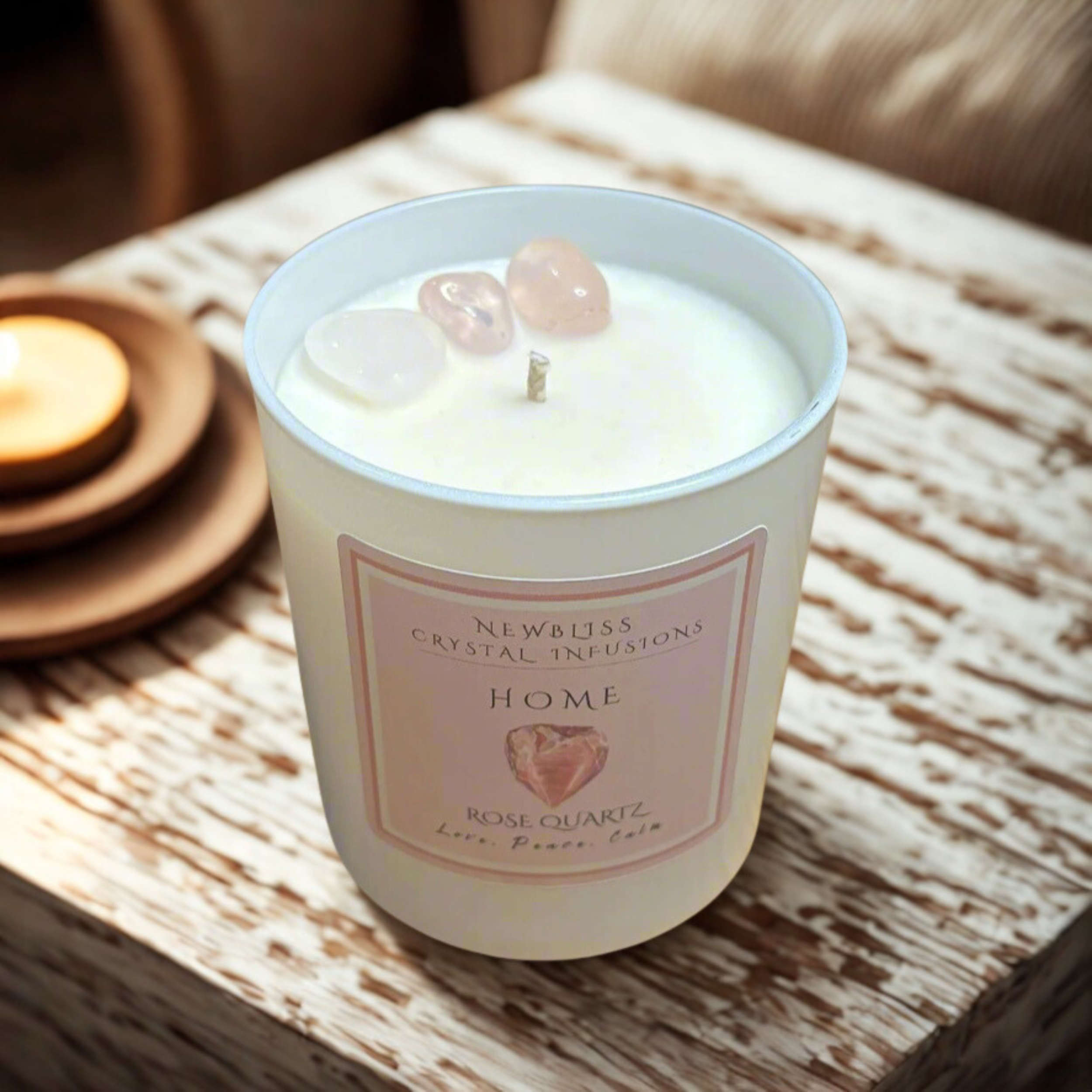 A historic stone building with a light blue wooden door, small rectangular windows above the door, and a climbing plant with red berries growing near the entrance.