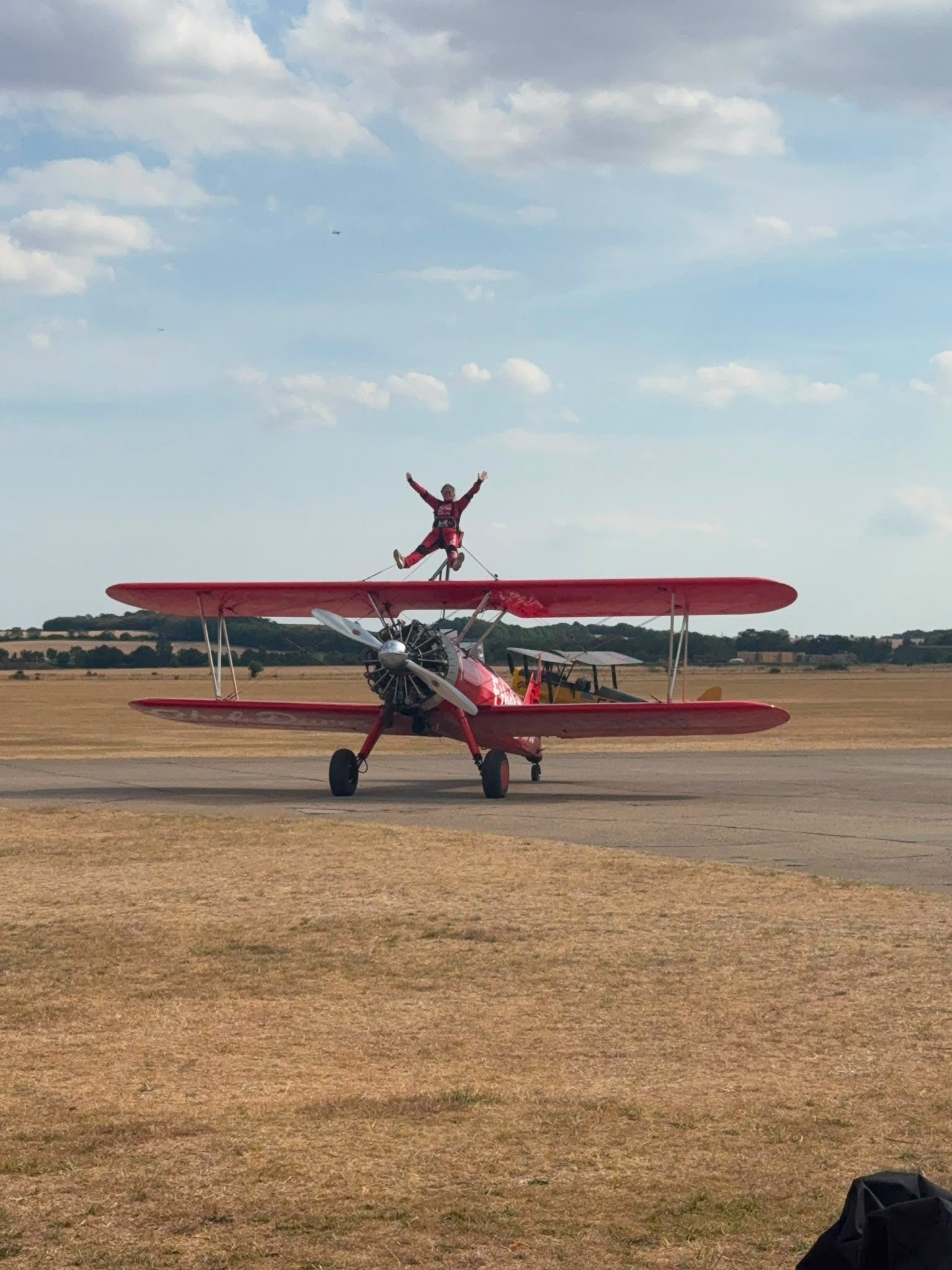 Woman on top of a plane