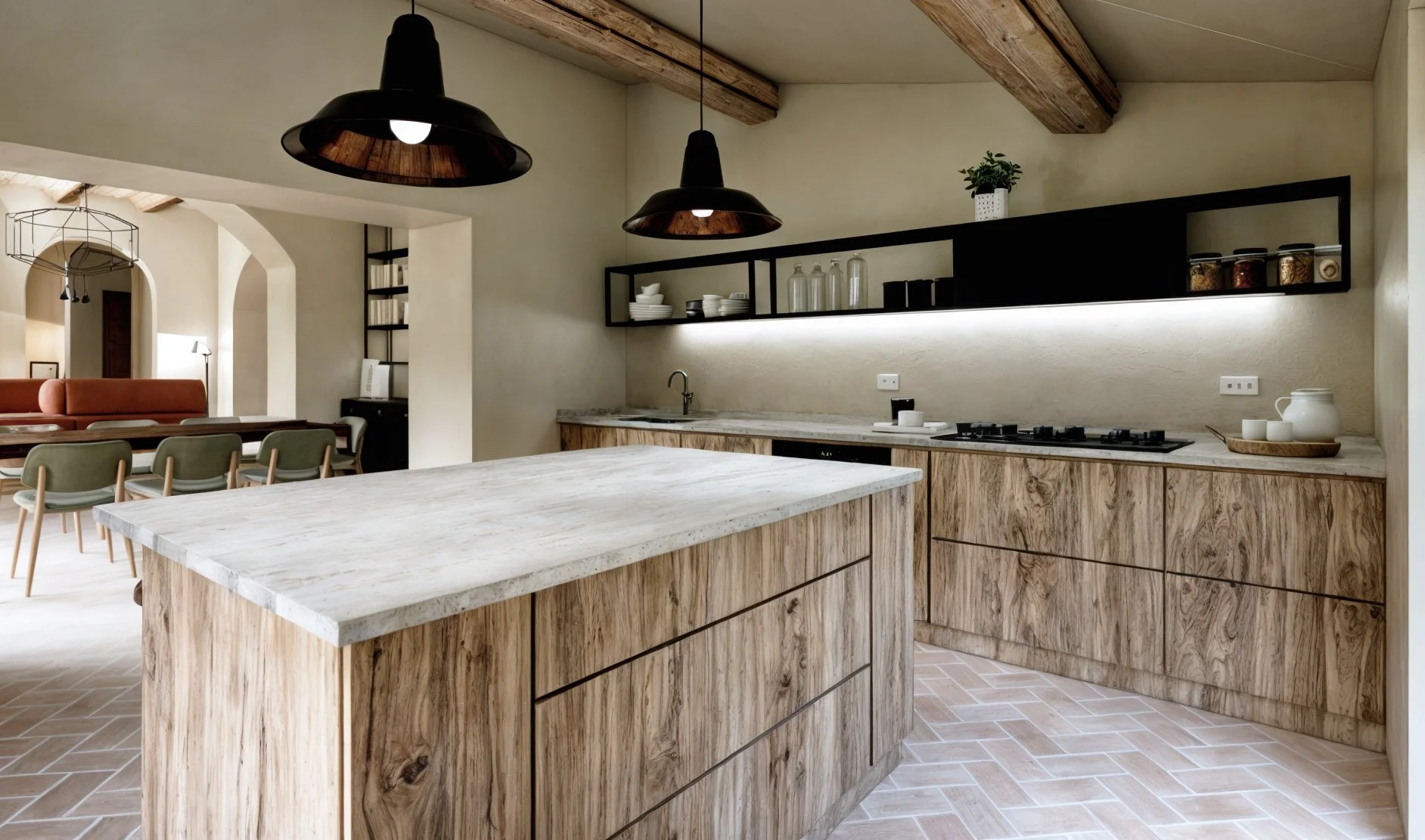 Modern kitchen with wooden cabinets and a marble island, black pendant lights, open shelving with dishes, a countertop with a sink, stove, and kitchenware, and a dining area with chairs and a sofa in the background.