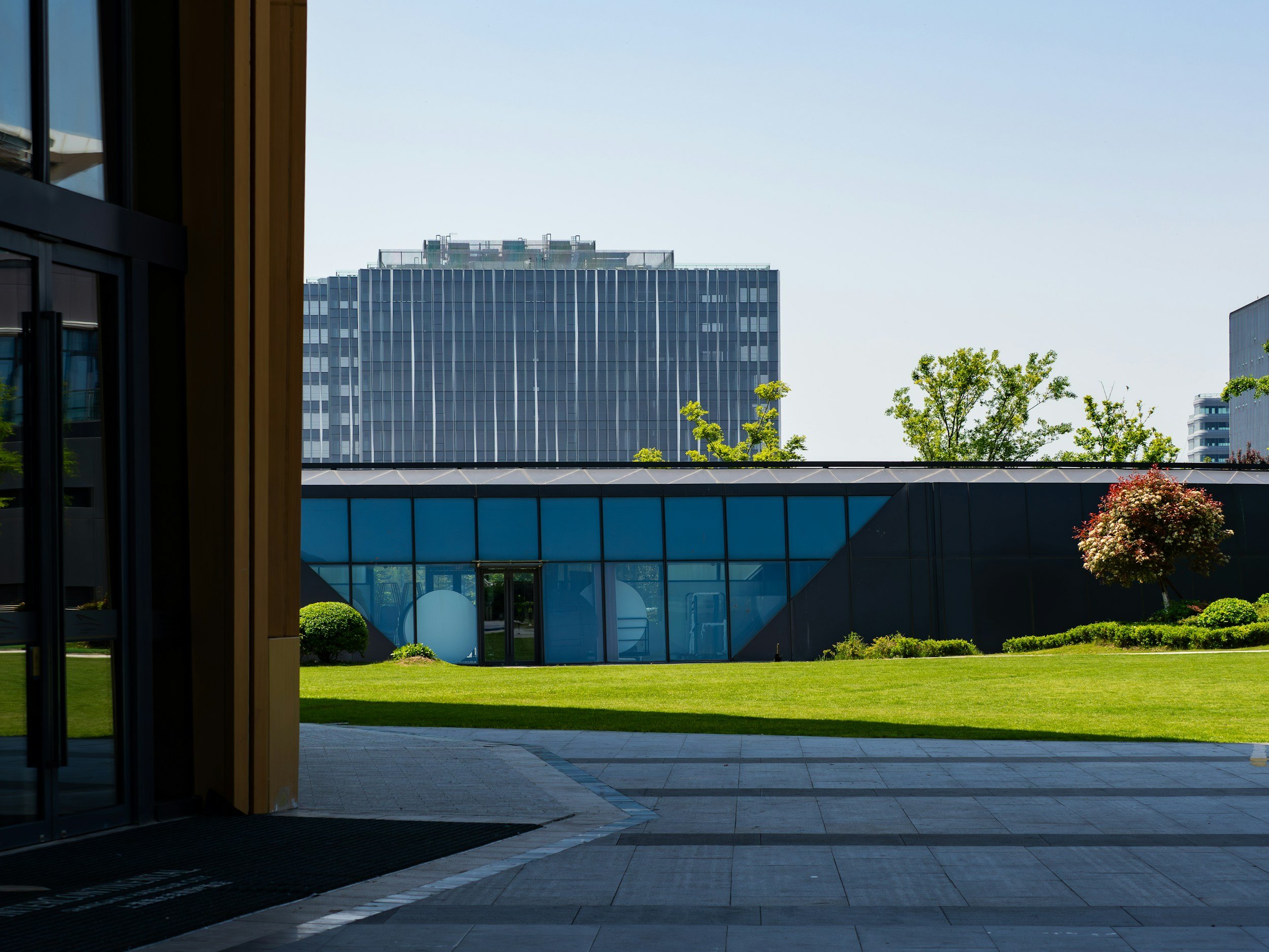 Landscaped grounds outside a modern office building