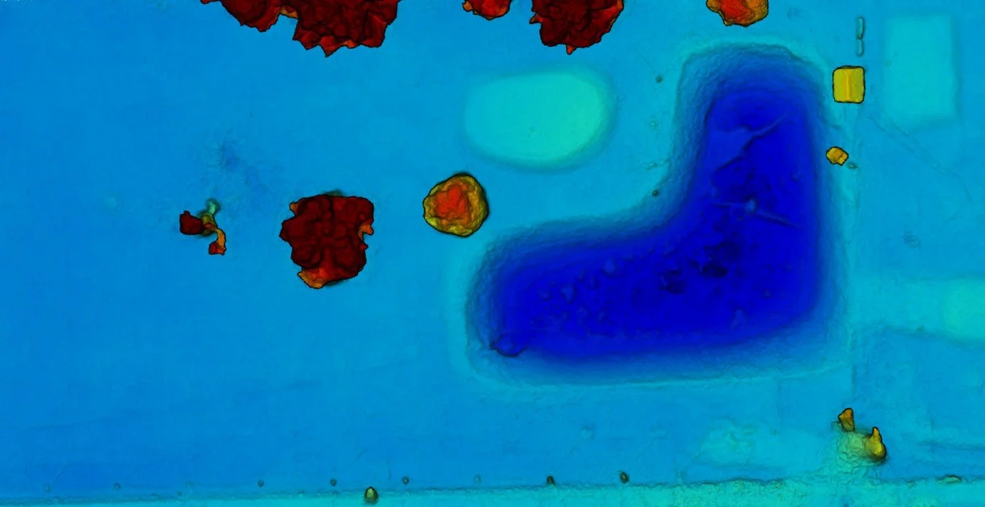 An aerial view of a field with elevation changes.