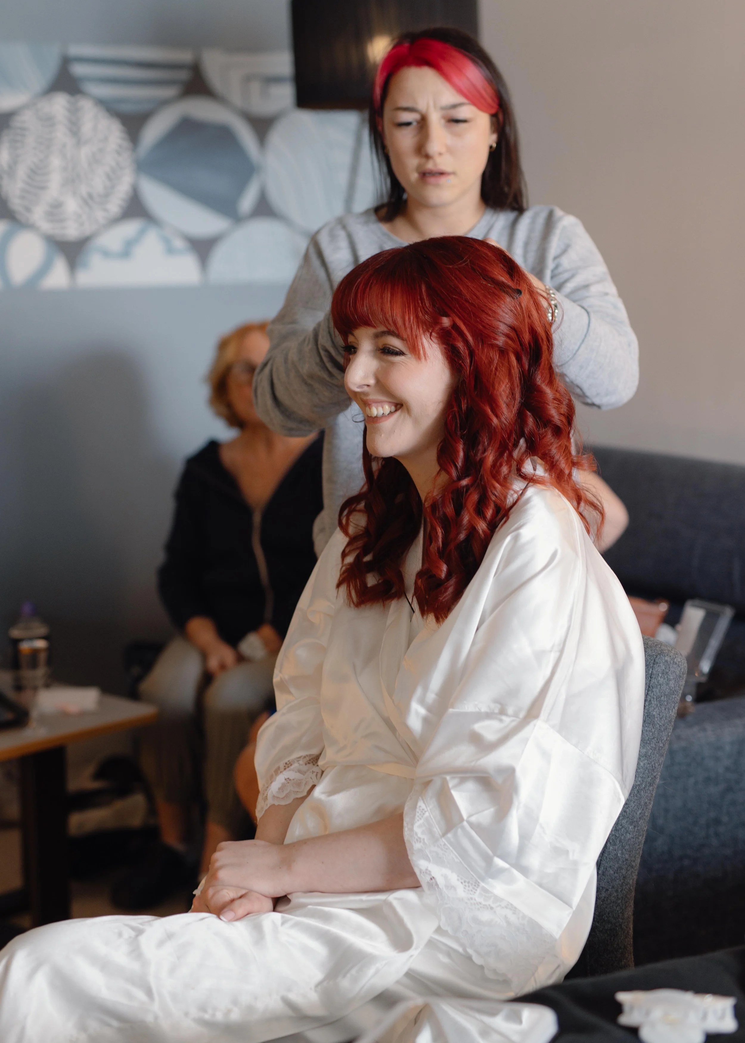 bride having her hair done for wedding devon wedding photographer mel clapp weddings 