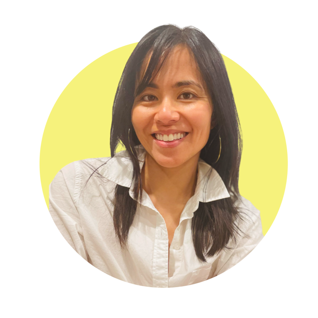 A woman with shoulder-length black hair, wearing a white shirt and hoop earrings, smiling against a yellow circular background.