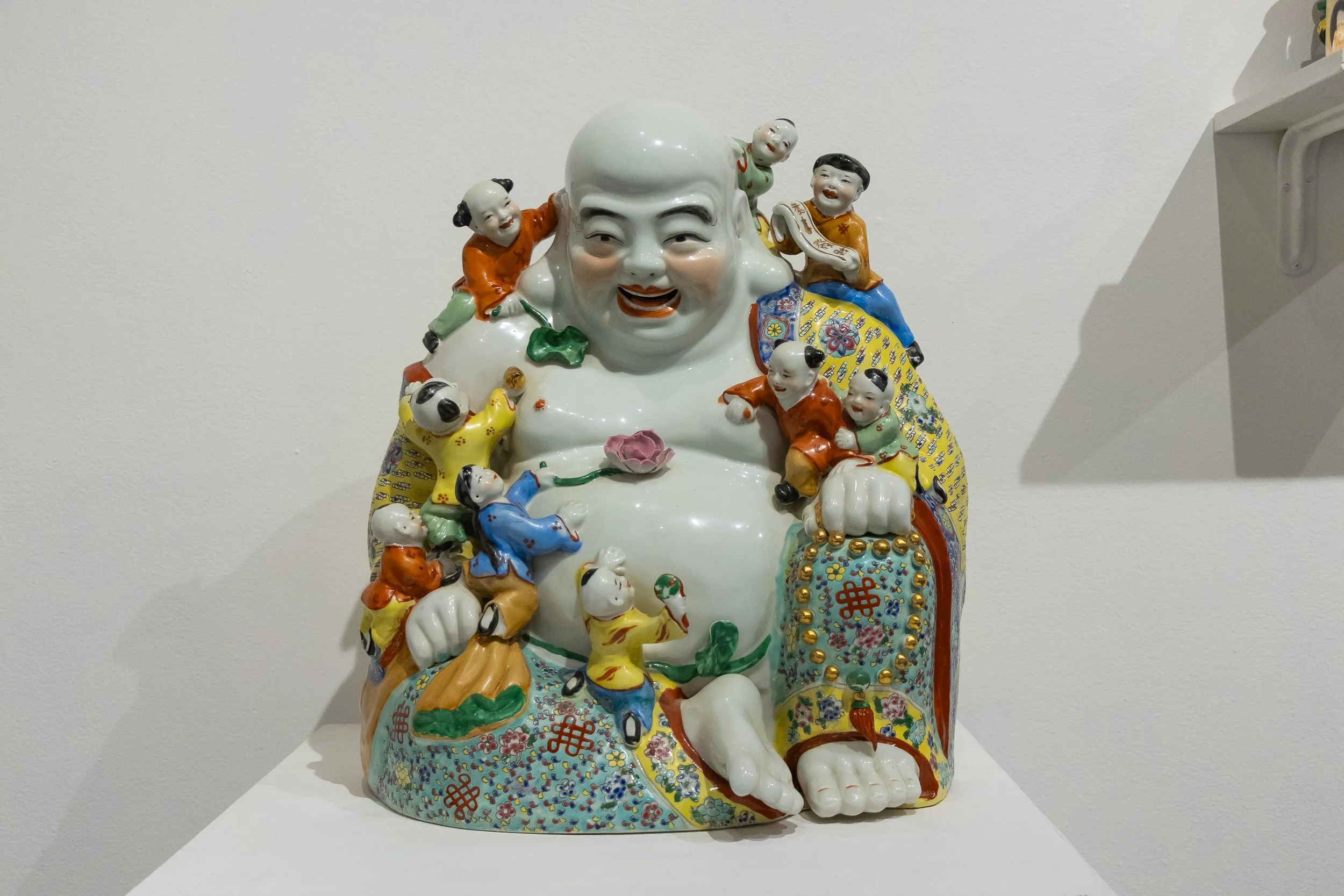 Laughing Buddha: A housewarming gift to Simon Huang from his mom, this Buddha symbolizes joy and prosperity.
