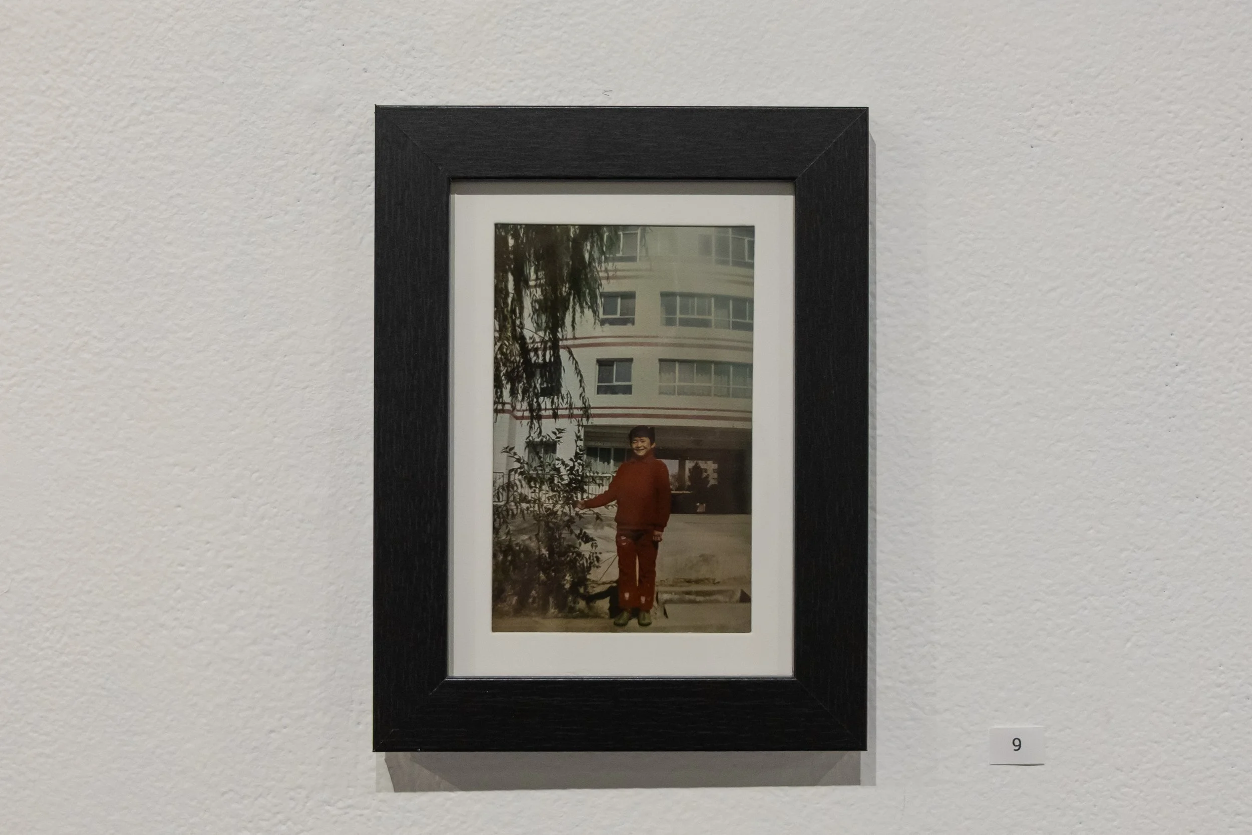 Photo: Claire Lott stands in front of the orphanage where she lived until she was 8 years old.