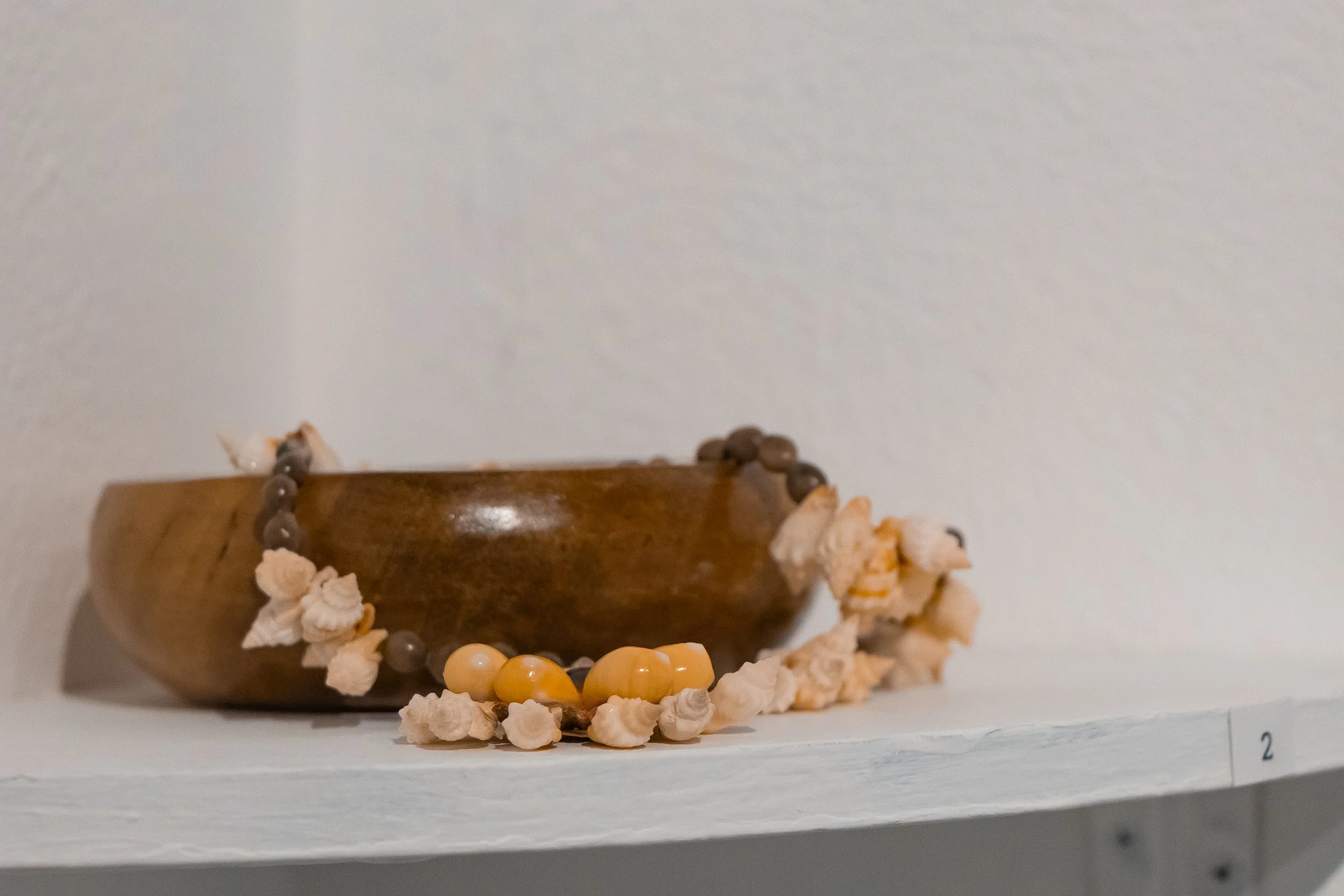 Bowl and Necklace: These items are traditional to the Chuuk and Northern Mariana Islands, where Joe Pangelinan was raised.