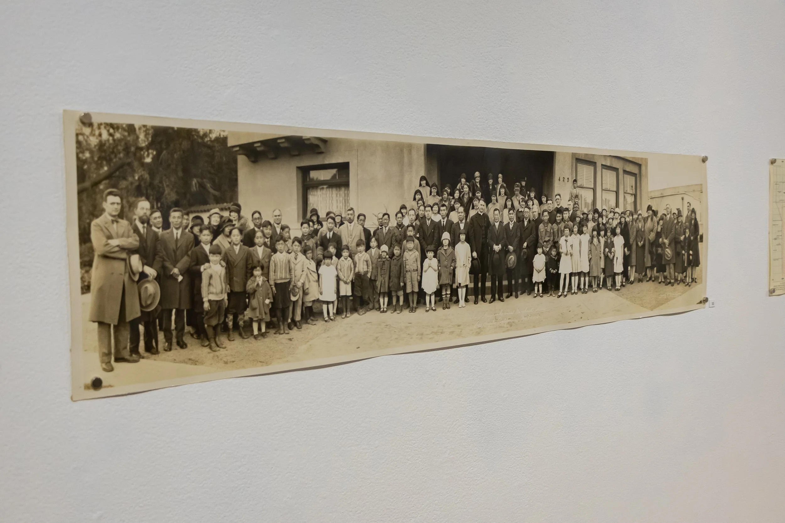 Photo: This photo commemorates the visit of Bishop Hayasaka to Maryknoll in Los Angeles in 1928. Tim Ema's father is among the children pictured.