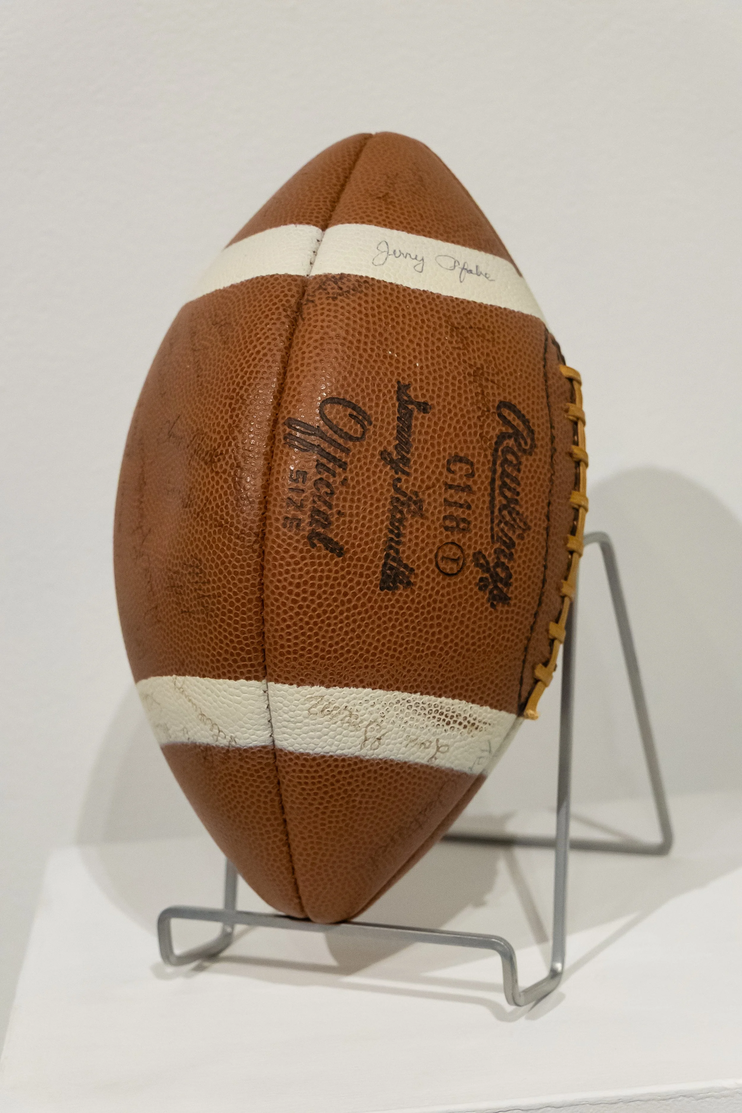 Football: Ed Shew was selected to the 1966 all-league football team for "outstanding ability and skill" and inherited this signed football from the head coach.