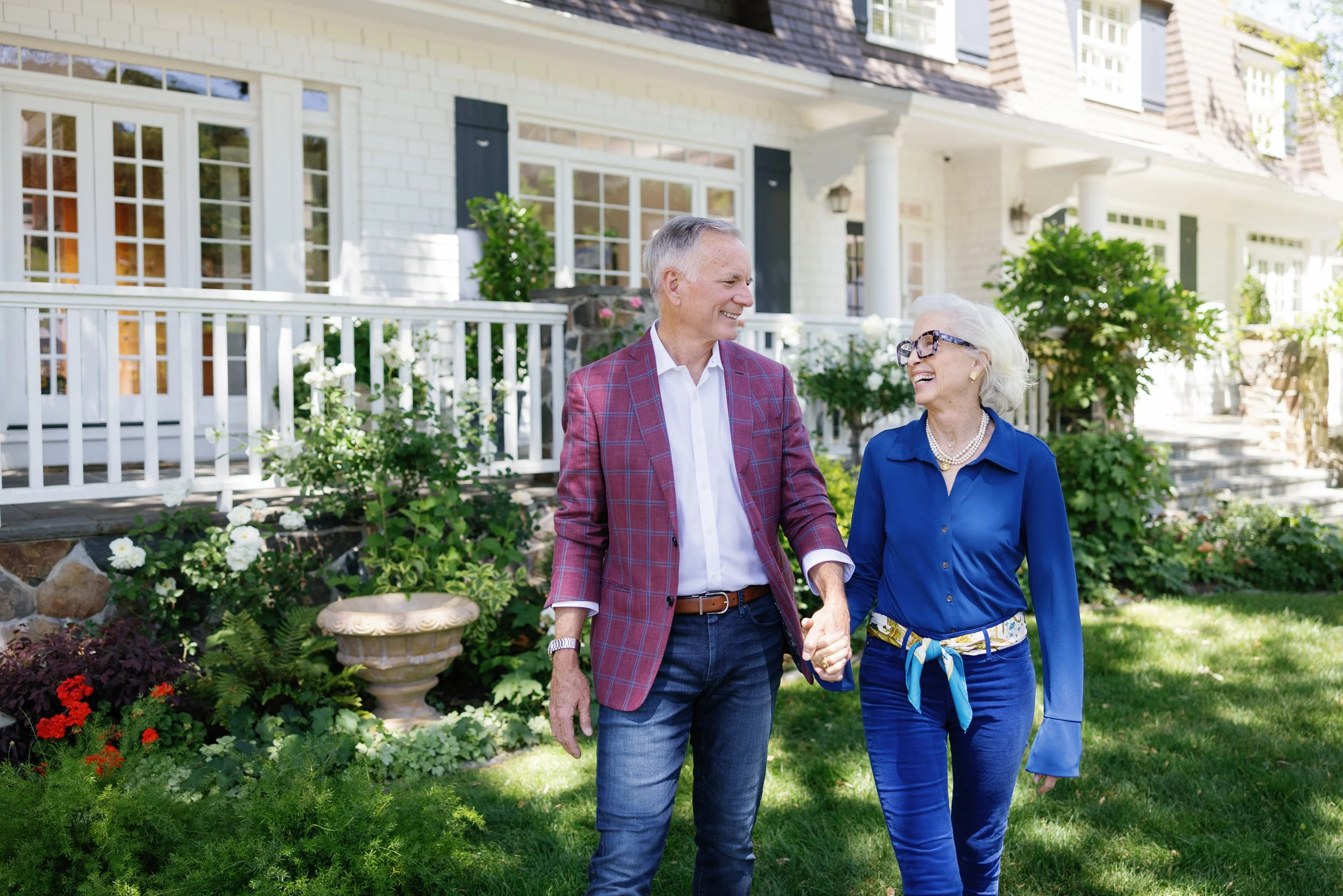 An older couple smiles at each other during filming for a commercial