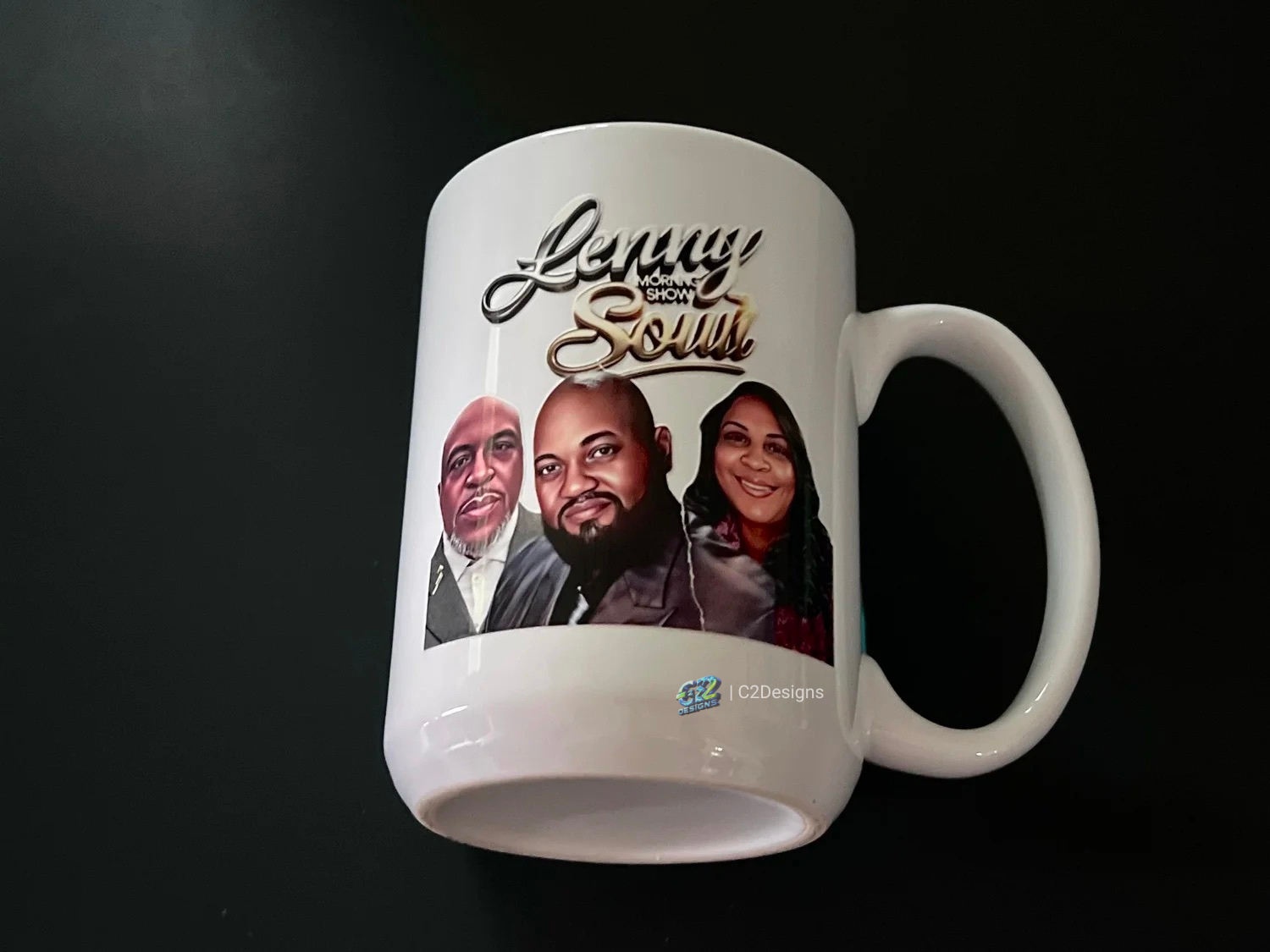 White mug featuring images of three people and the text 'Leroy Morning Show Soult' in colorful fonts.
