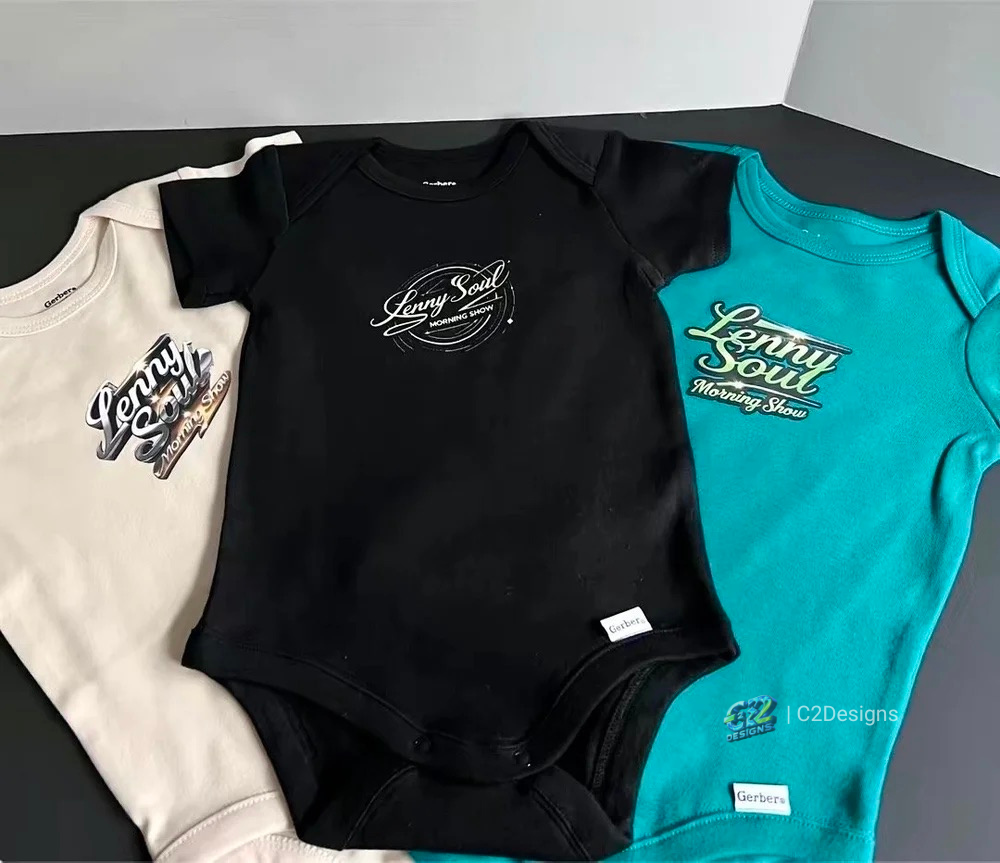 Three baby bodysuits in white, black, and teal, each with a "Lenny Soul Morning Show" logo design.