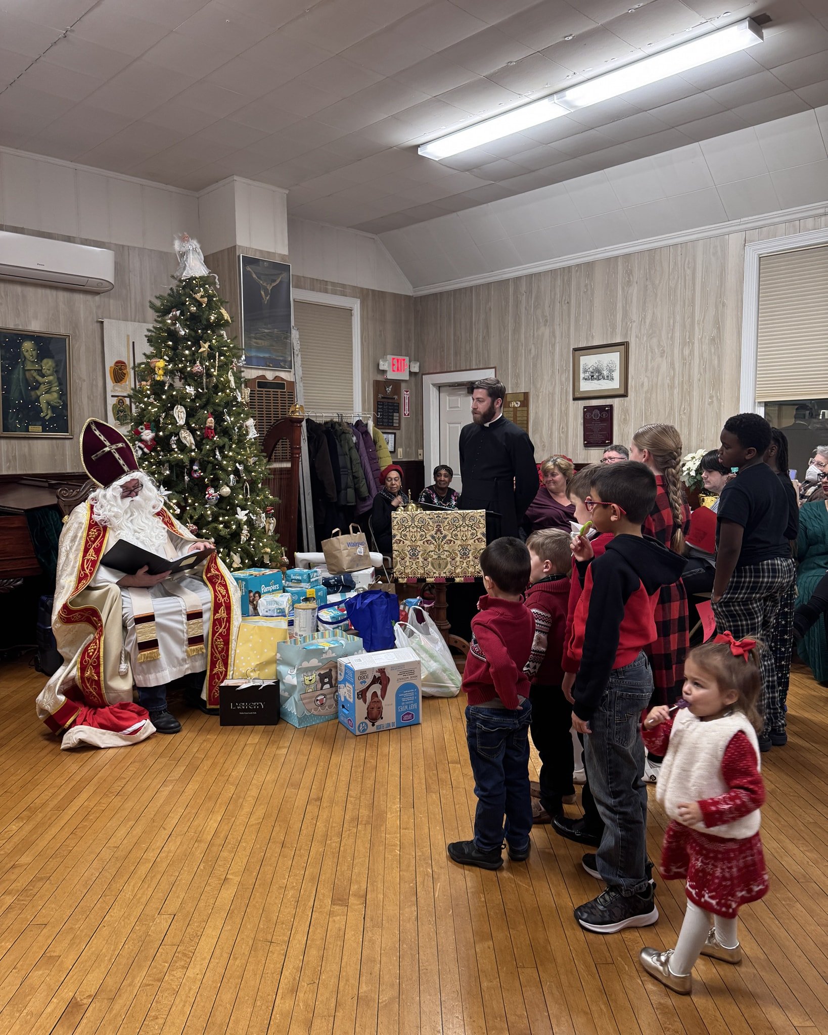 Our St. Nicholas party was a big hit! Everyone enjoyed the delicious dinner and of course the visit from St. Nick who taught us about the spirit of giving. Many items were donated in support of the Life Center of Long Island. This might turn into a y