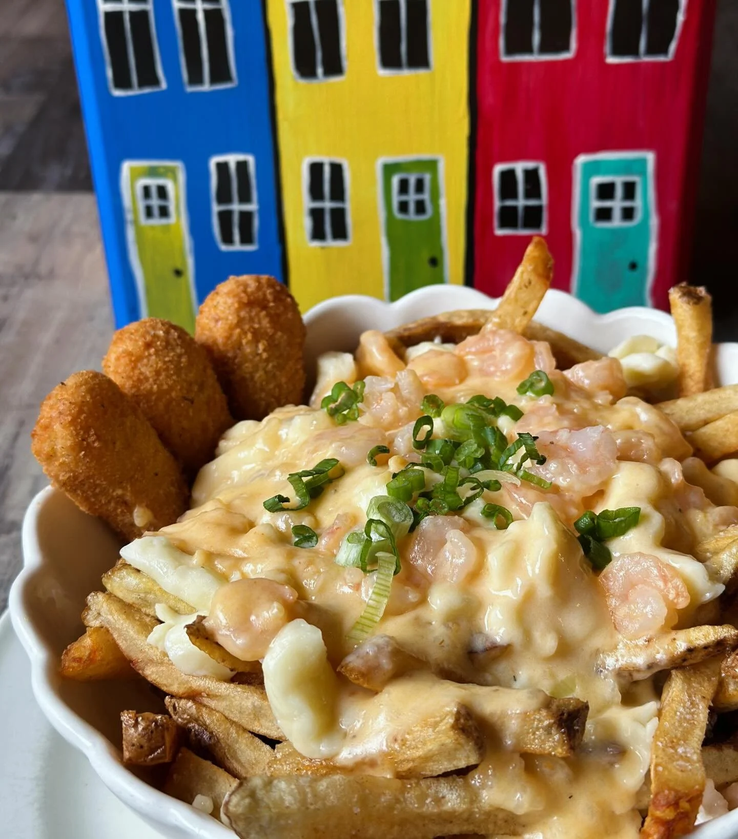 Oh my lanta&hellip; this is for the &lsquo;from the sea&rsquo; fan and oh so good!
The Newfie Shrimp Poutine
Fresh cut fries, saut&eacute;ed shrimp, cheese curds, creamy shrimp gravy, jalape&ntilde;o-seafood poppers and a little green onion dusting! 