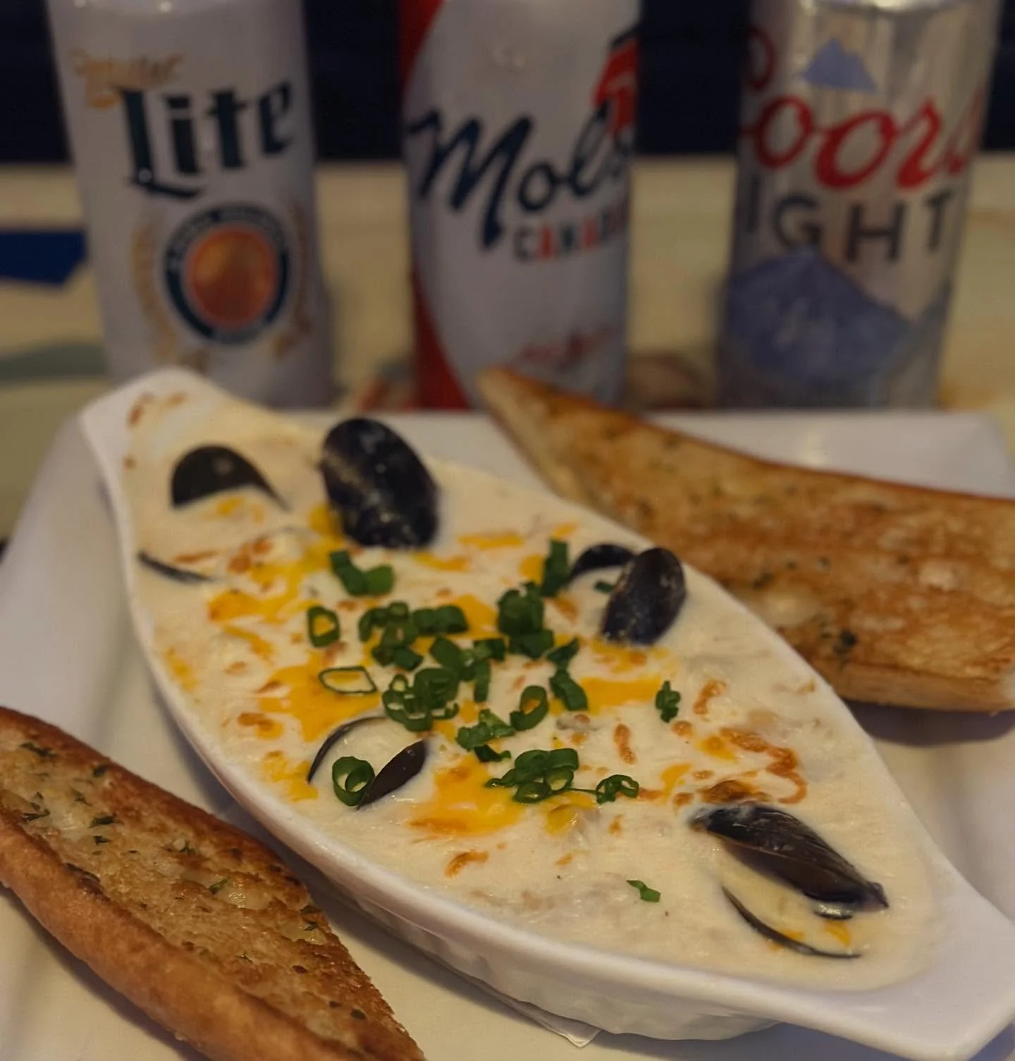 Wheres my fellow seafood fans?
Todays feature is a created just for us and trust me, you do not Wanta miss it!
Dockside Seafood Au Gratin
Bay scallops, shrimp, baby clams, PEI mussels &amp; potato all simmered in a cheesy cream sauce with garlic toas